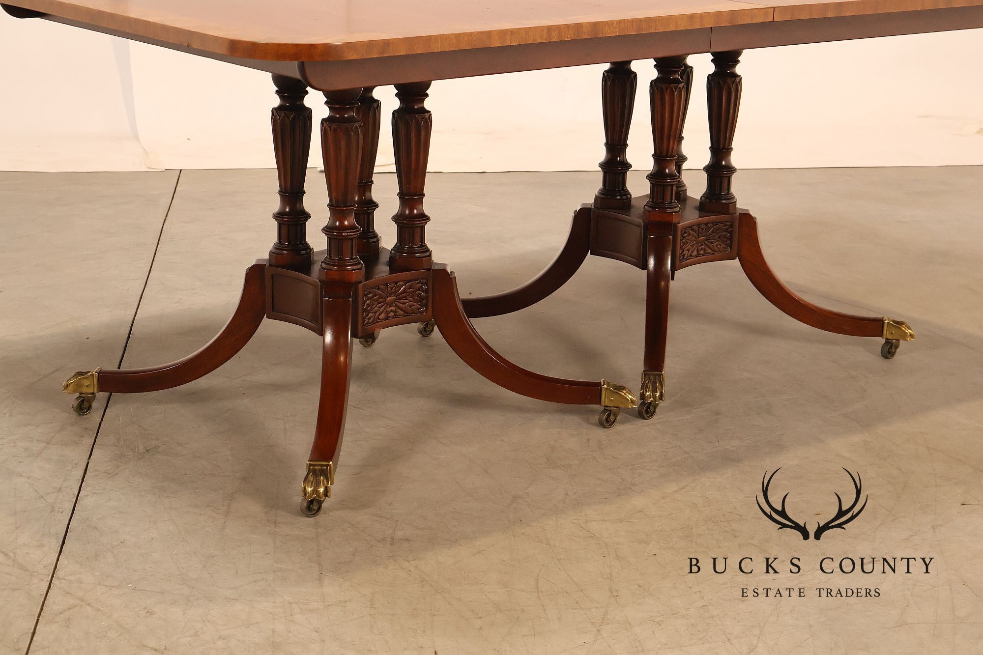 Baker Furniture Company Regency Style Mahogany Double Pedestal Dining Table With Satinwood Banding And Extension Leaves