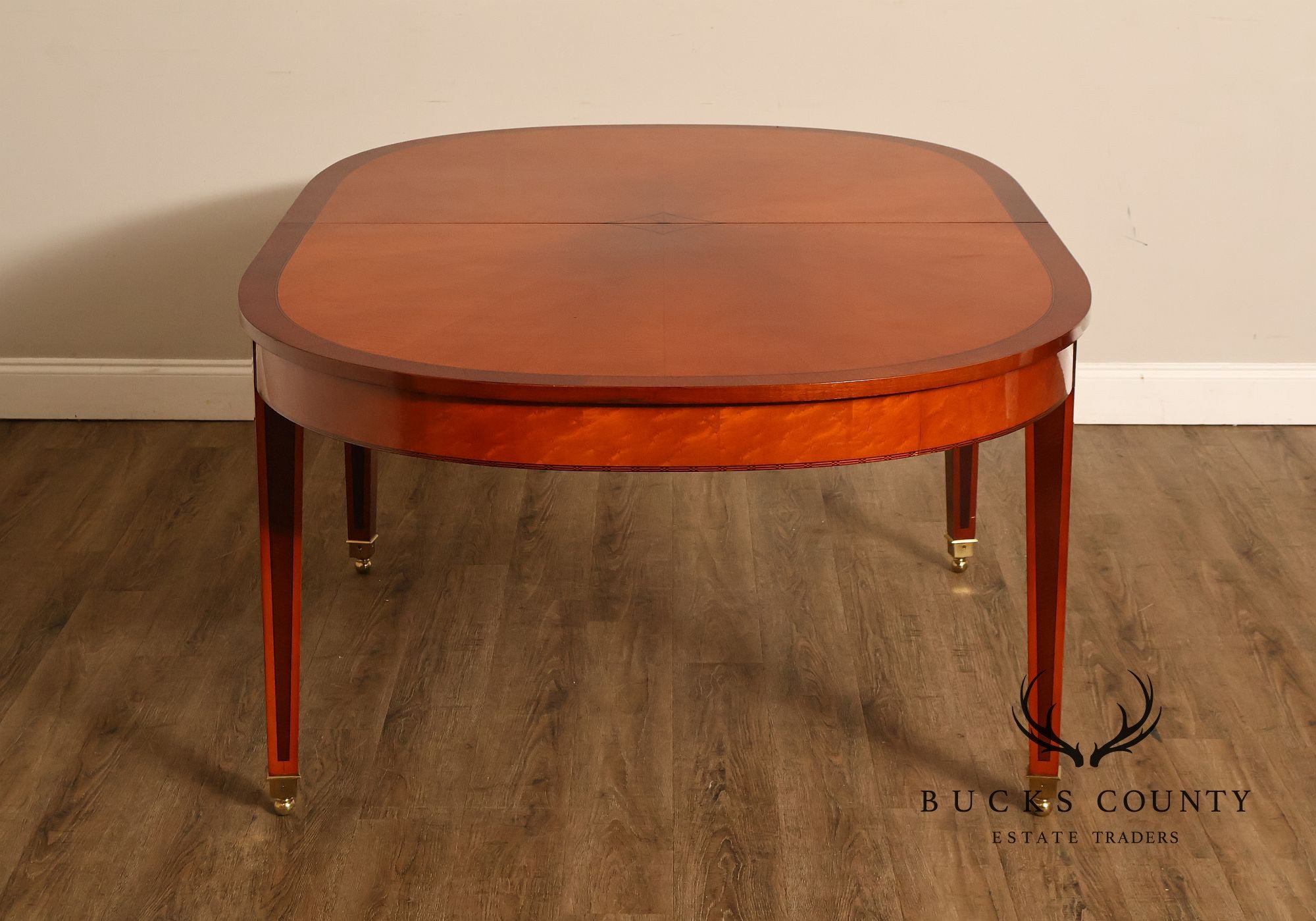 Kindel Kent Mahogany Banded Oval Dining Table with Three Leaves