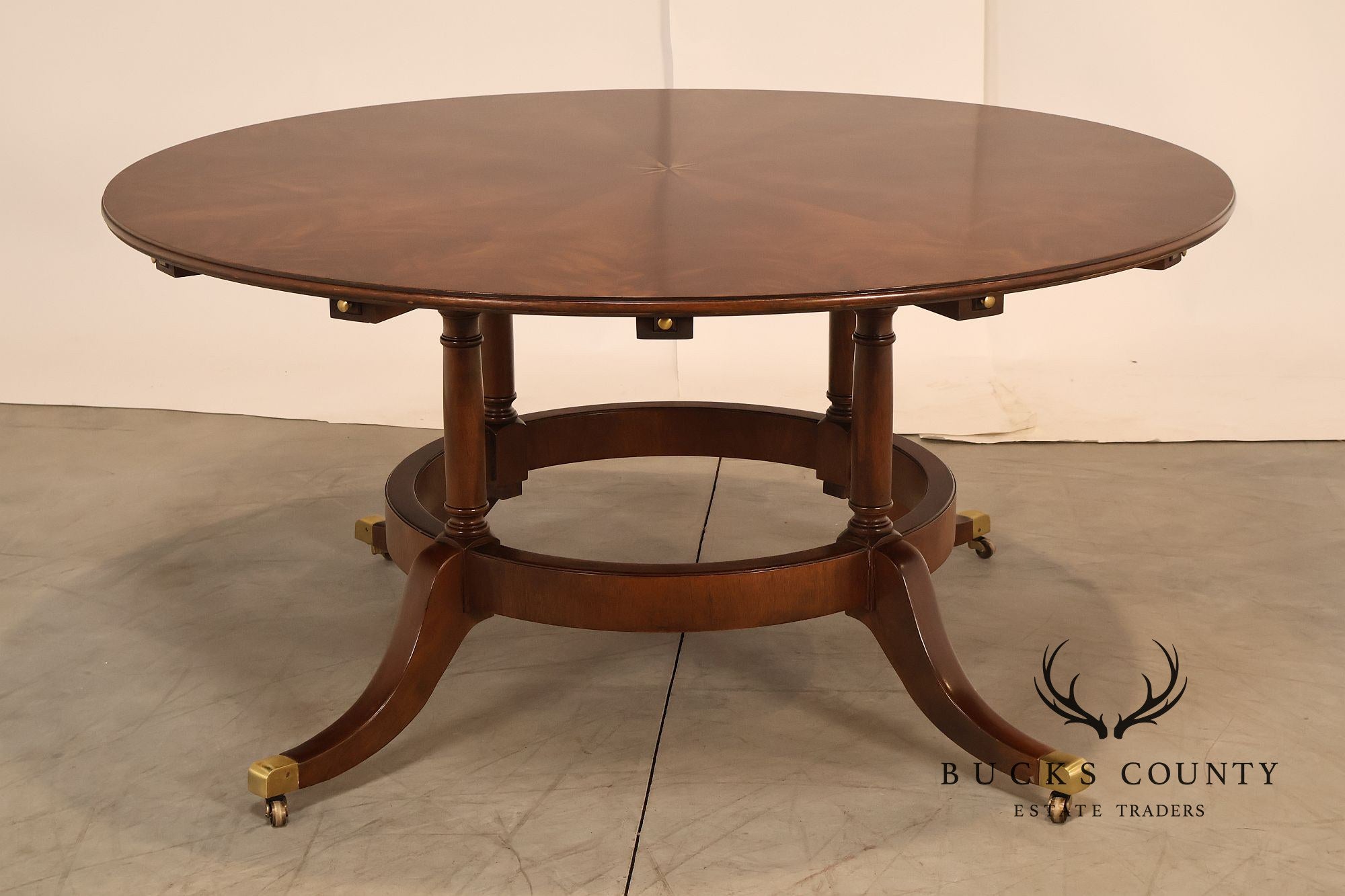 E.J. Victor Regency Style Round Inlaid Mahogany Pedestal Dining Table
