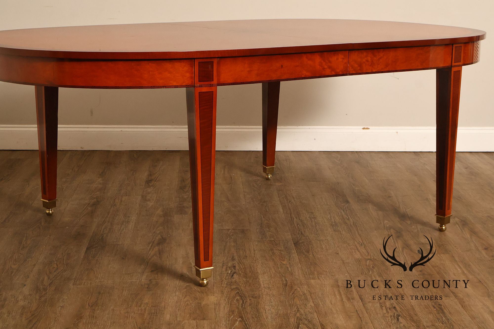 Kindel Kent Mahogany Banded Oval Dining Table with Three Leaves