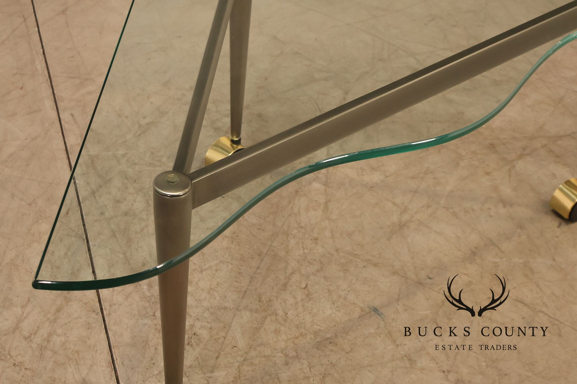 Postmodern Pair Of Triangular Glass Top Coffee Table with Brushed Steel Frame and Brass Casters