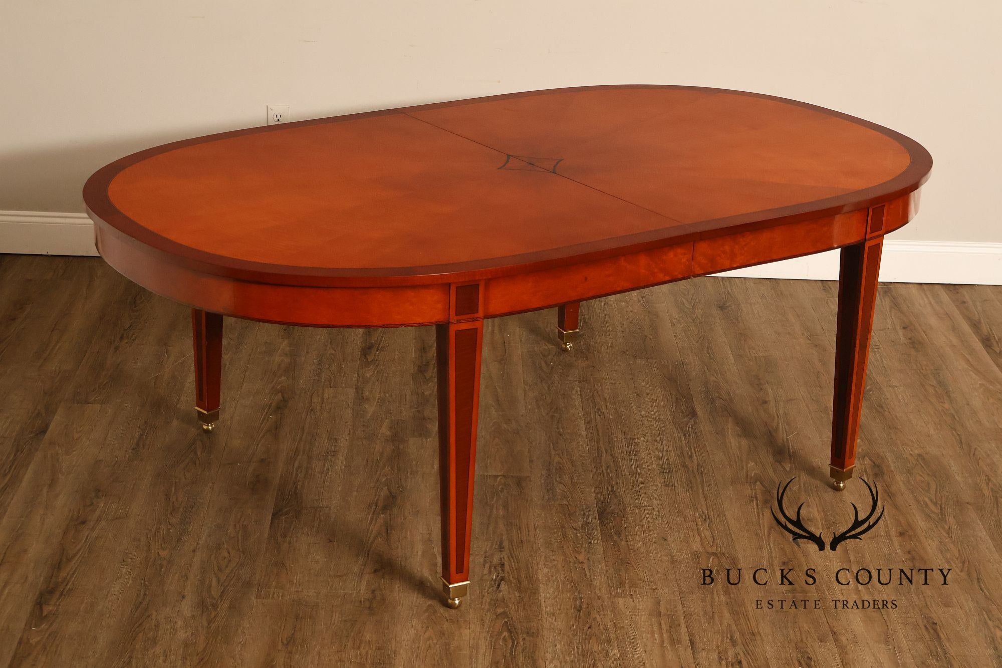 Kindel Kent Mahogany Banded Oval Dining Table with Three Leaves