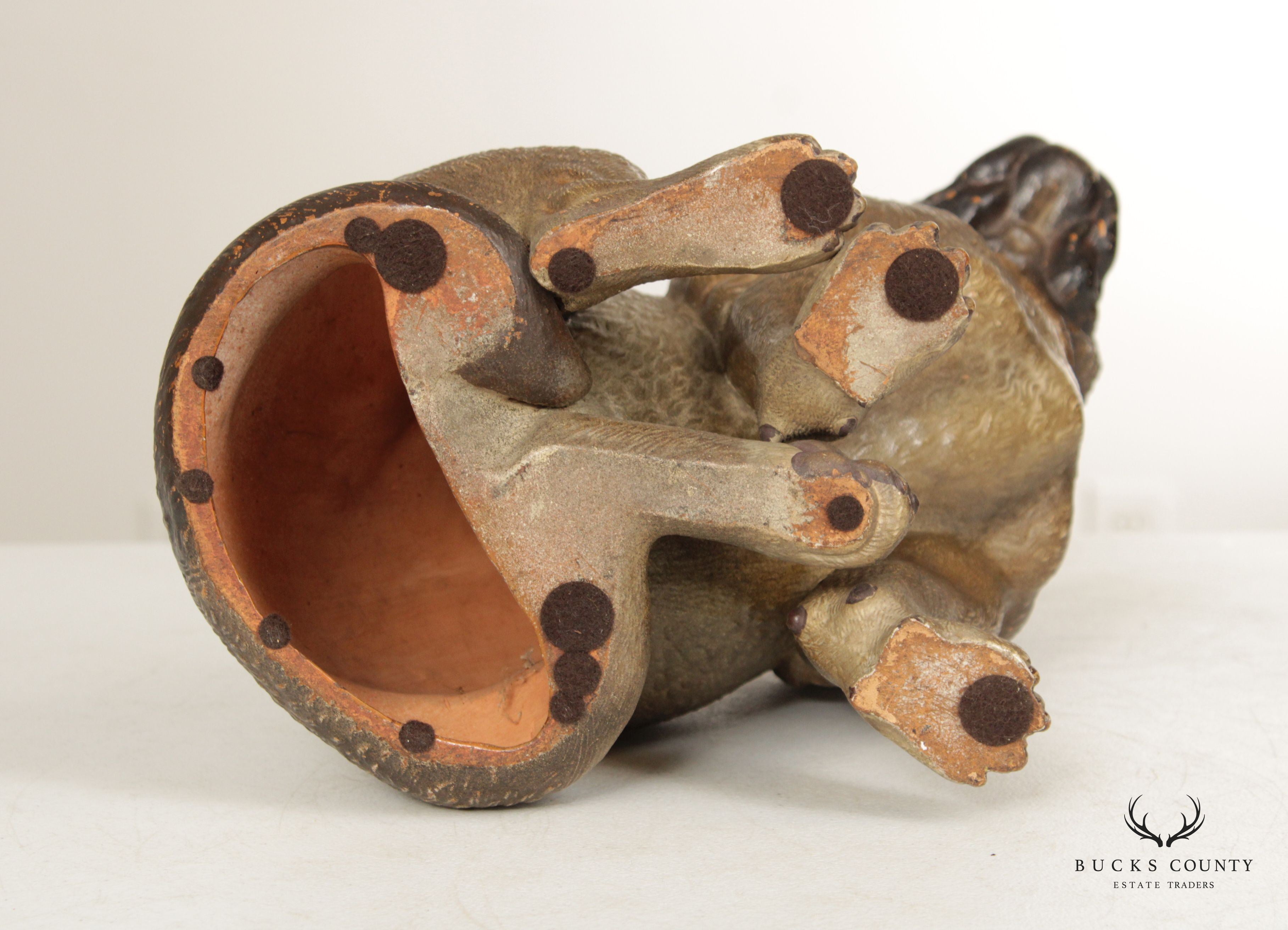 TERRA COTTA SITTING PUG DOG STATUE ATTRIBUTED TO GOLDSCHEIDER