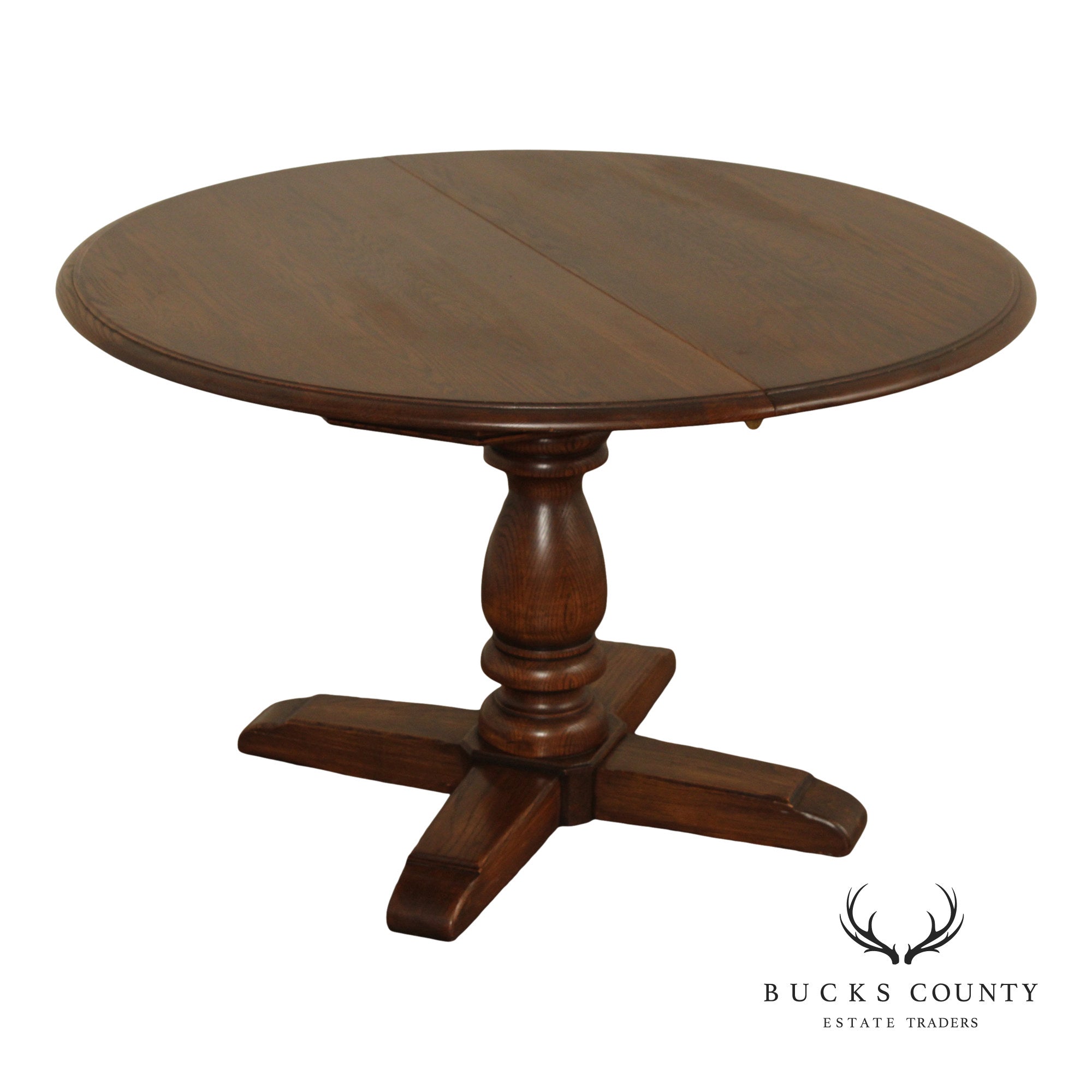 Conant Ball Round Oak Single Pedestal Dining Table With Two Leaves
