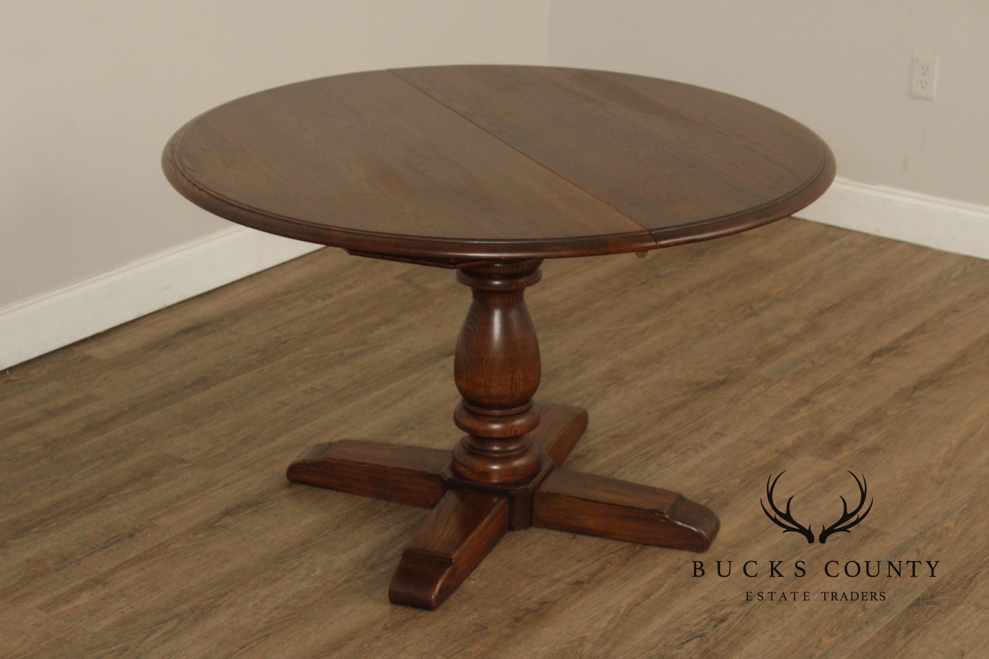 Conant Ball Round Oak Single Pedestal Dining Table With Two Leaves