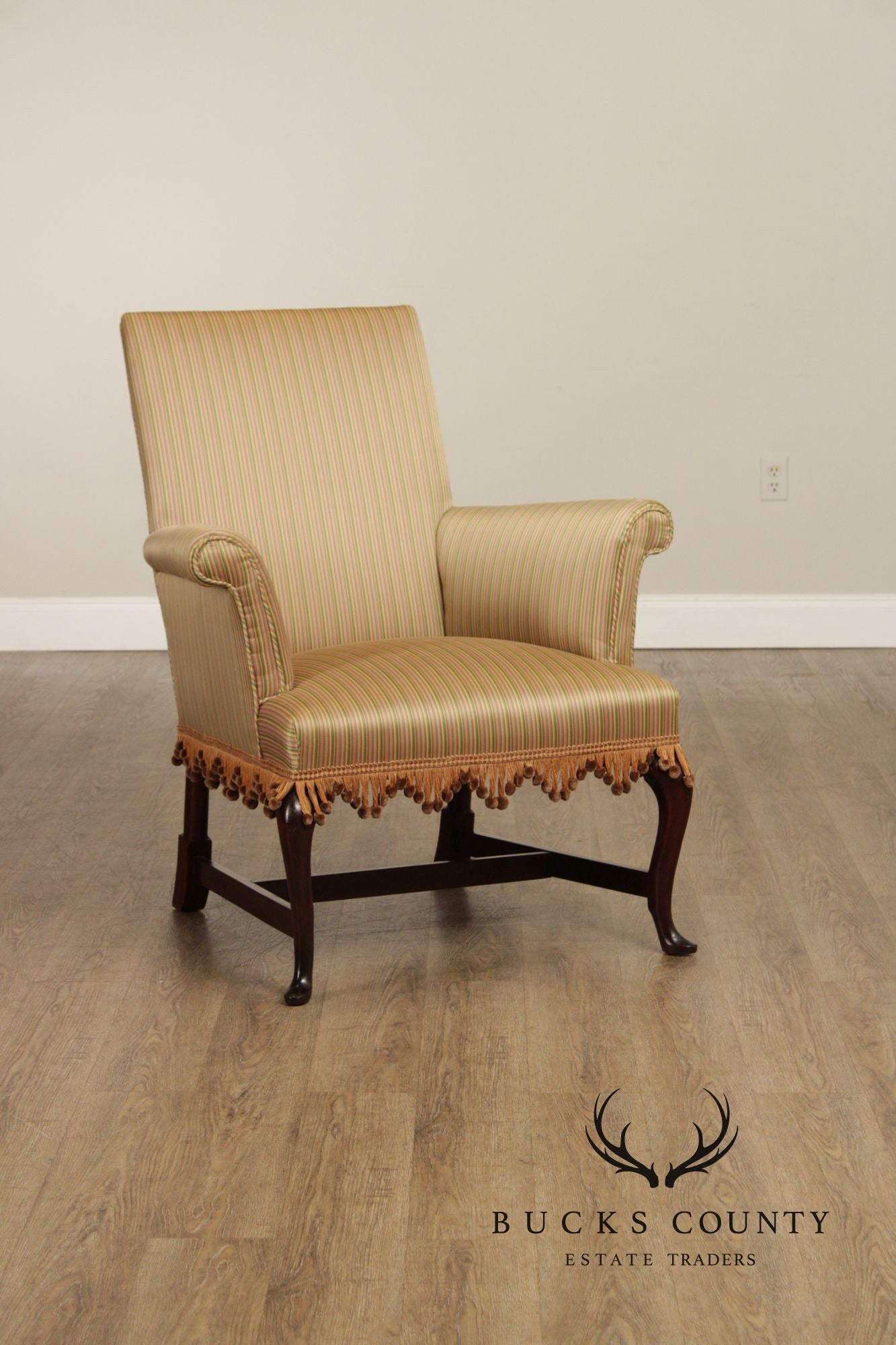 Queen Anne Style Upholstered Armchair With Striped Fabric And Fringe Skirt