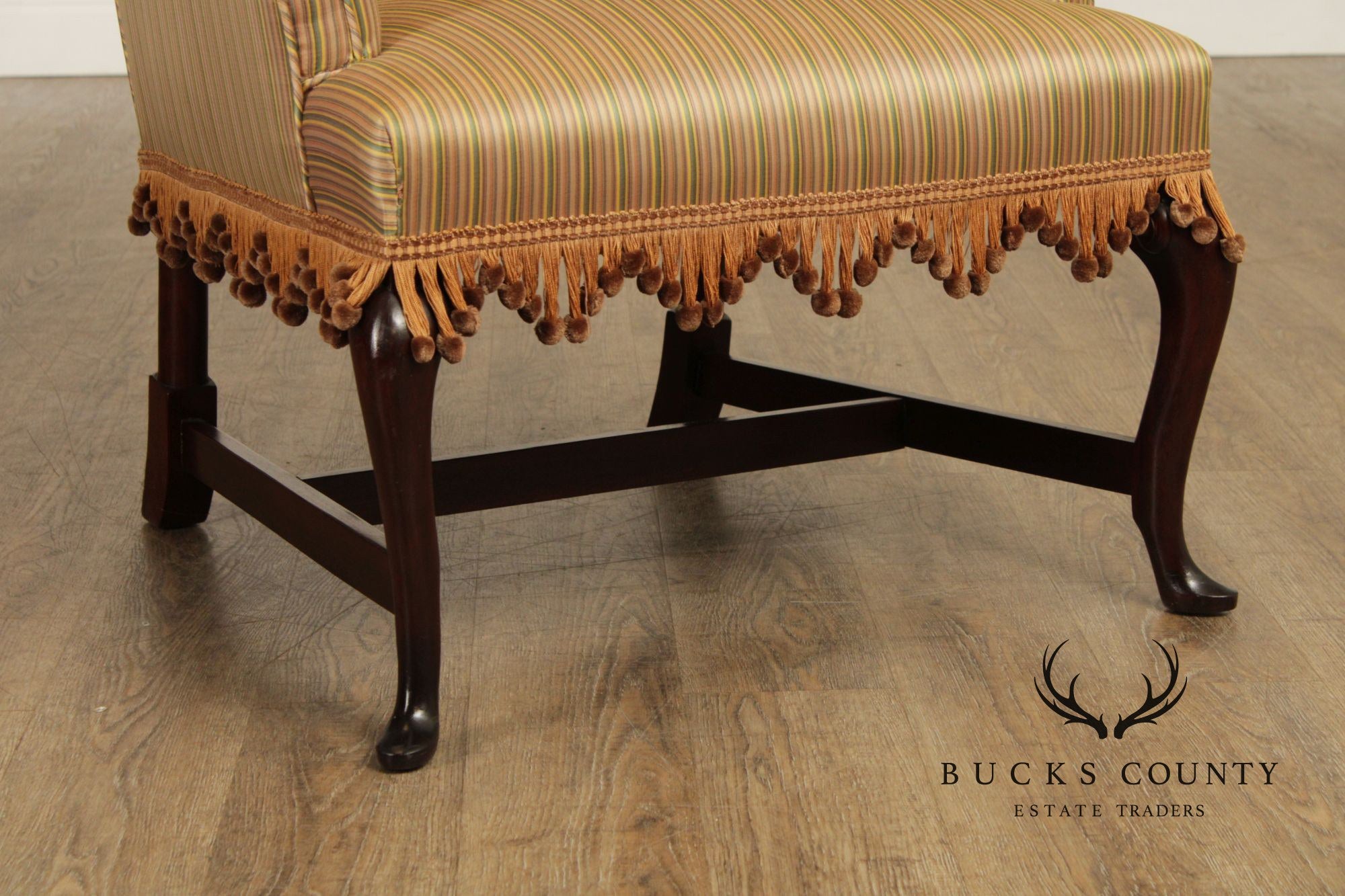 Queen Anne Style Upholstered Armchair With Striped Fabric And Fringe Skirt