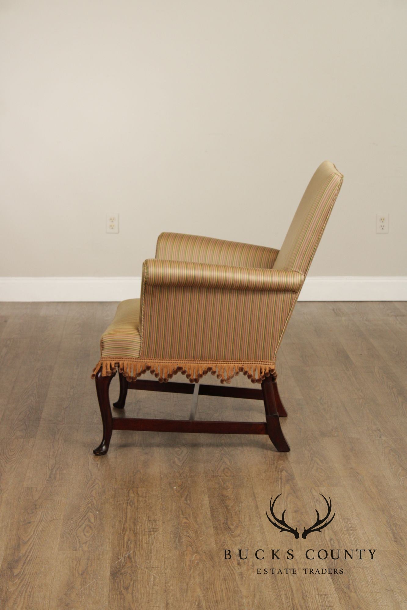 Queen Anne Style Upholstered Armchair With Striped Fabric And Fringe Skirt