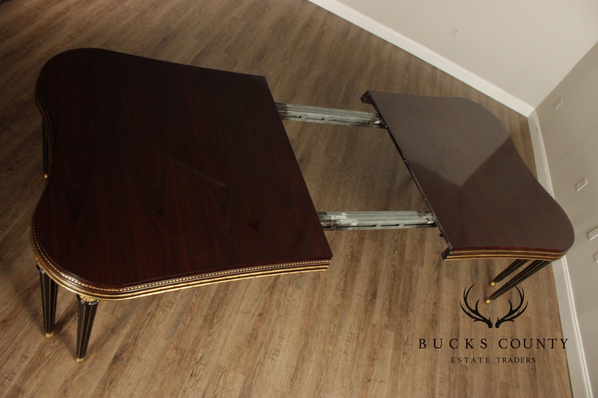 EJ Victor Mahogany And Gilt Dining Table With One Leaf