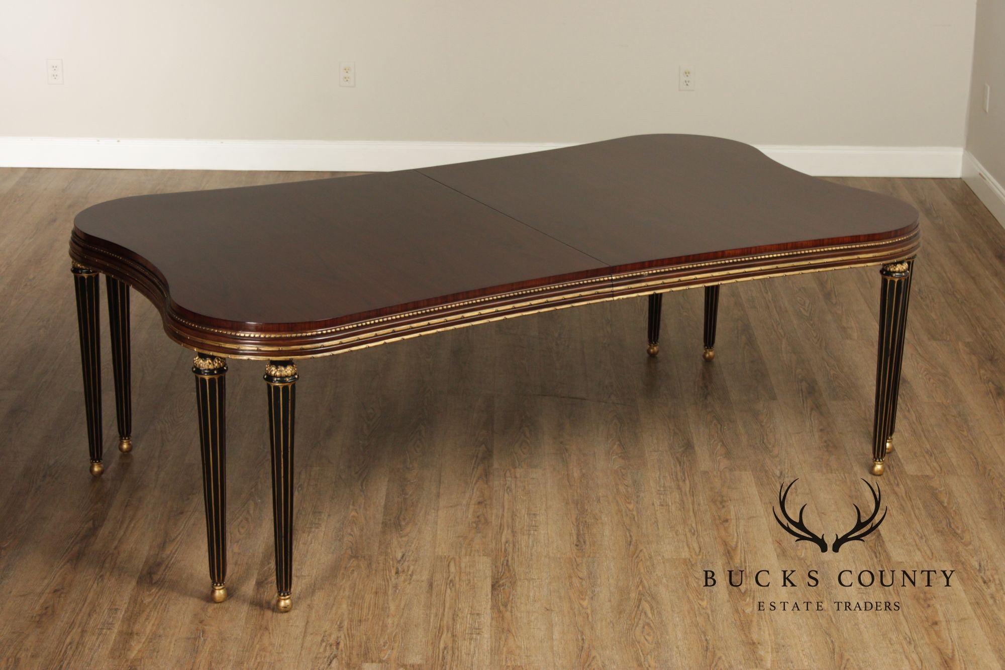 EJ Victor Mahogany And Gilt Dining Table With One Leaf