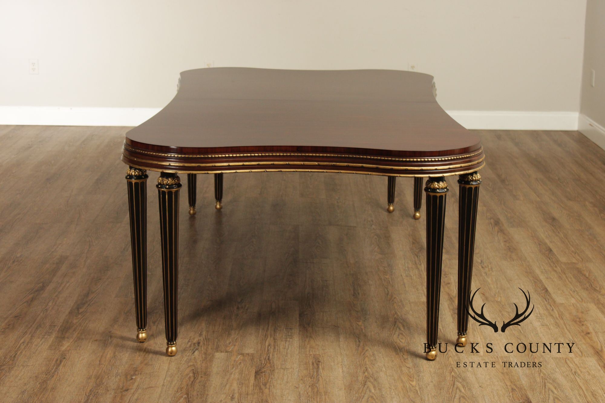 EJ Victor Mahogany And Gilt Dining Table With One Leaf