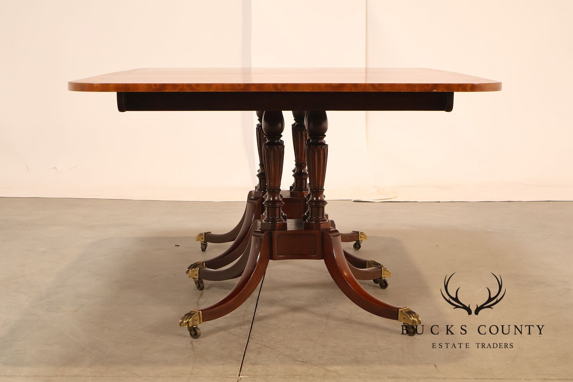 Baker Furniture Company Regency Style Mahogany Double Pedestal Dining Table With Satinwood Banding And Extension Leaves
