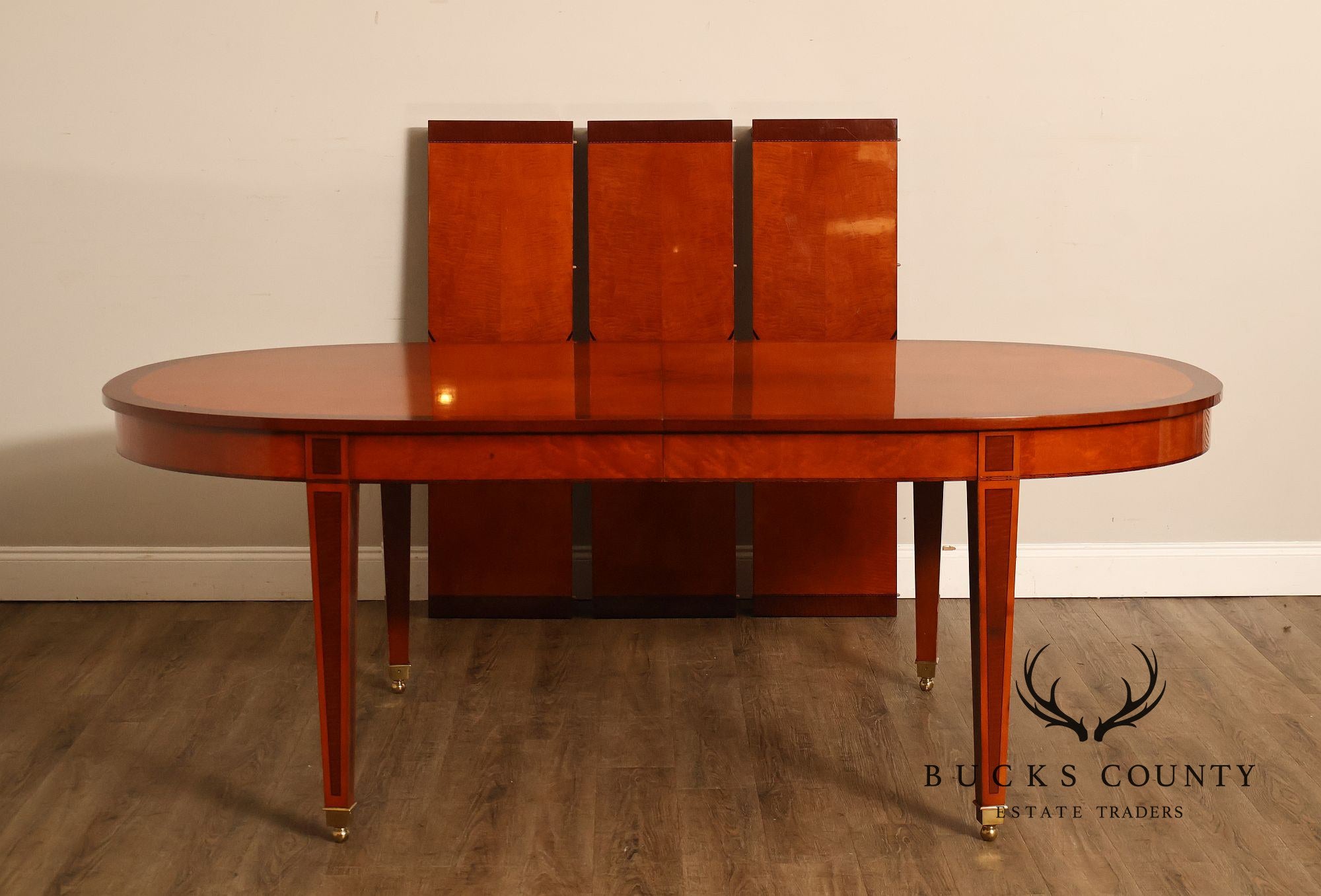Kindel Kent Mahogany Banded Oval Dining Table with Three Leaves