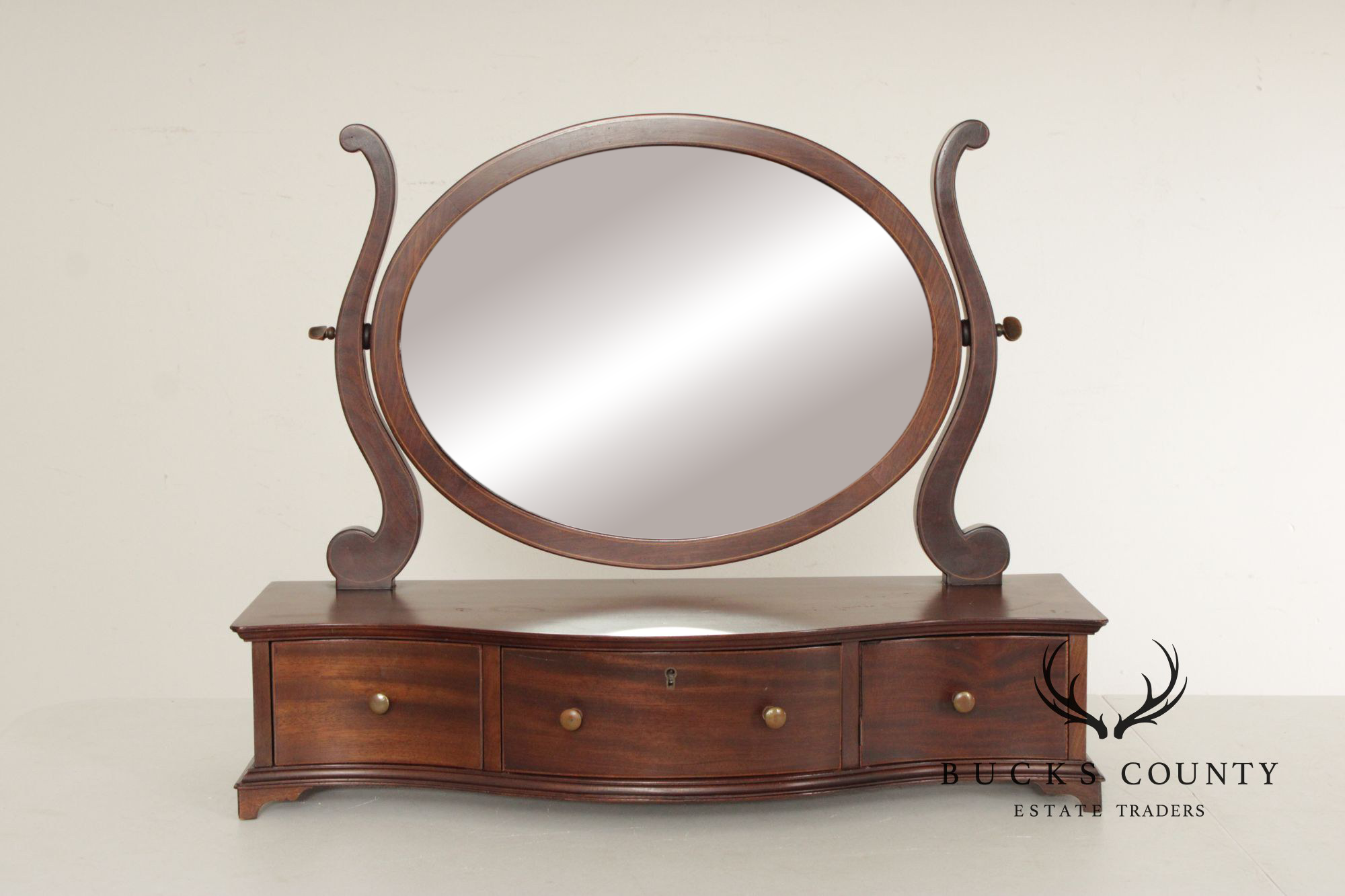 Potthast Bros. Federal Style Mahogany Shaving Mirror With Serpentine Base And Oval Swivel Glass