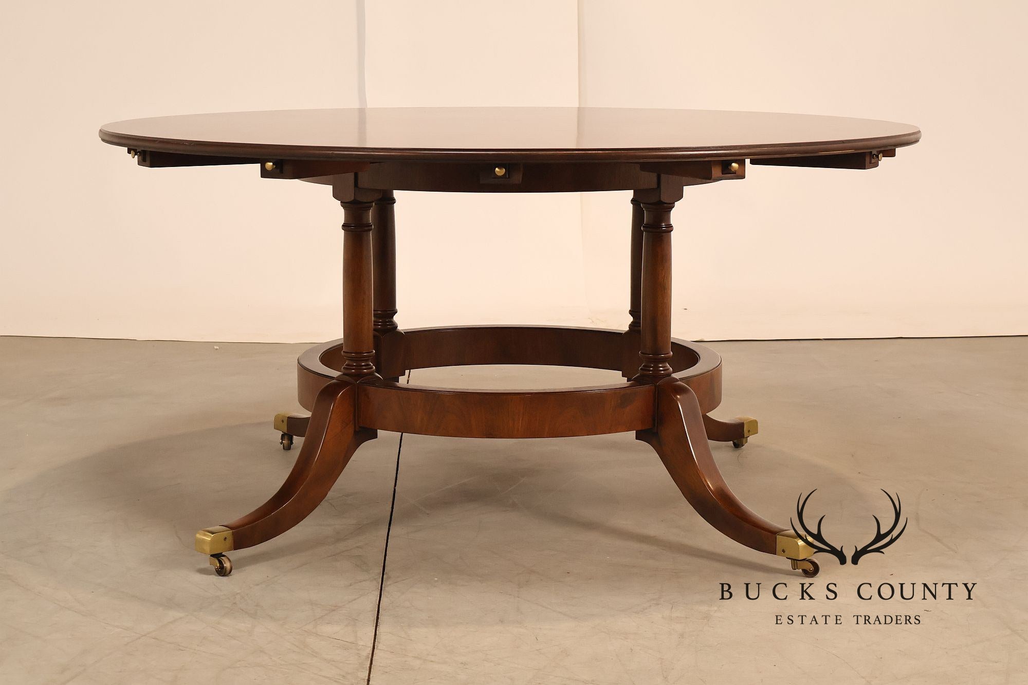 E.J. Victor Regency Style Round Inlaid Mahogany Pedestal Dining Table