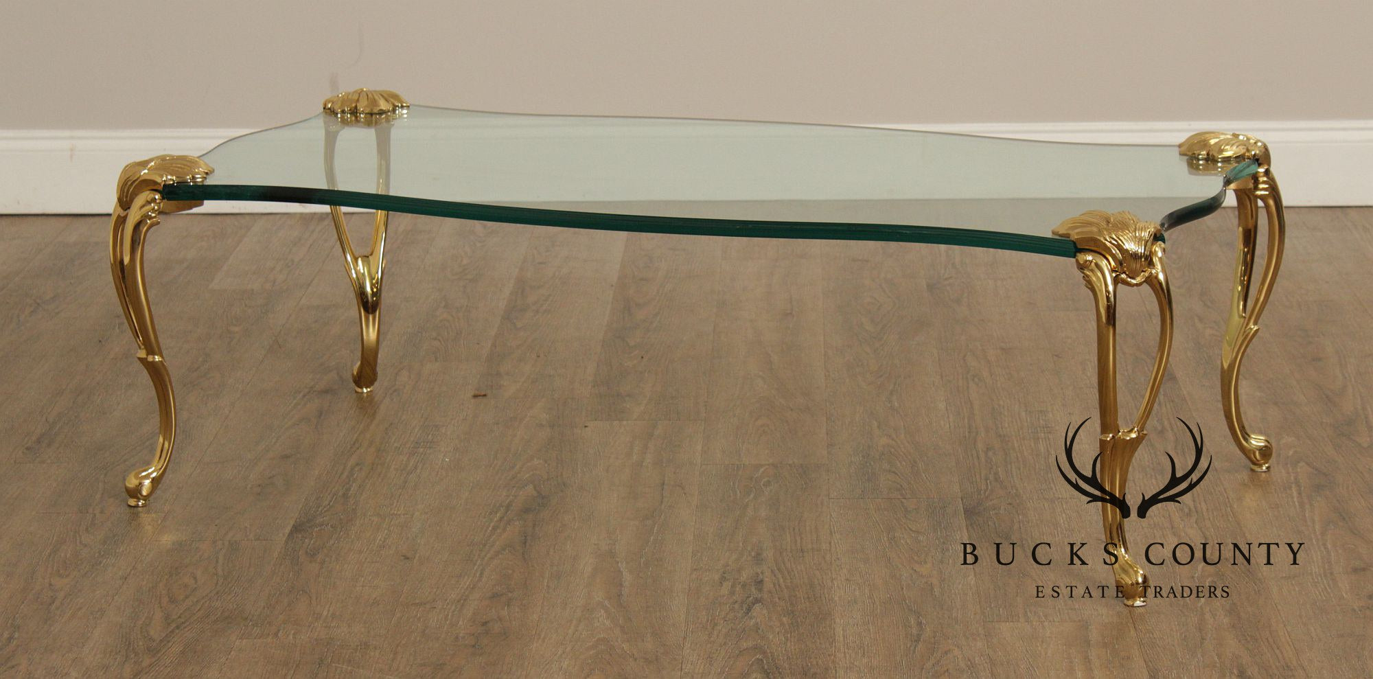French Style Glass Top Coffee Table With Sculpted Brass Legs