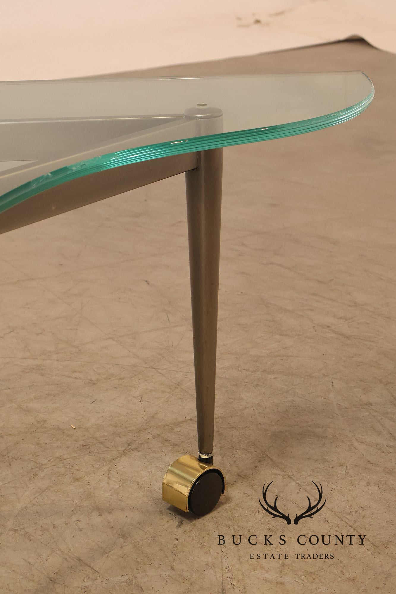 Postmodern Pair Of Triangular Glass Top Coffee Table with Brushed Steel Frame and Brass Casters