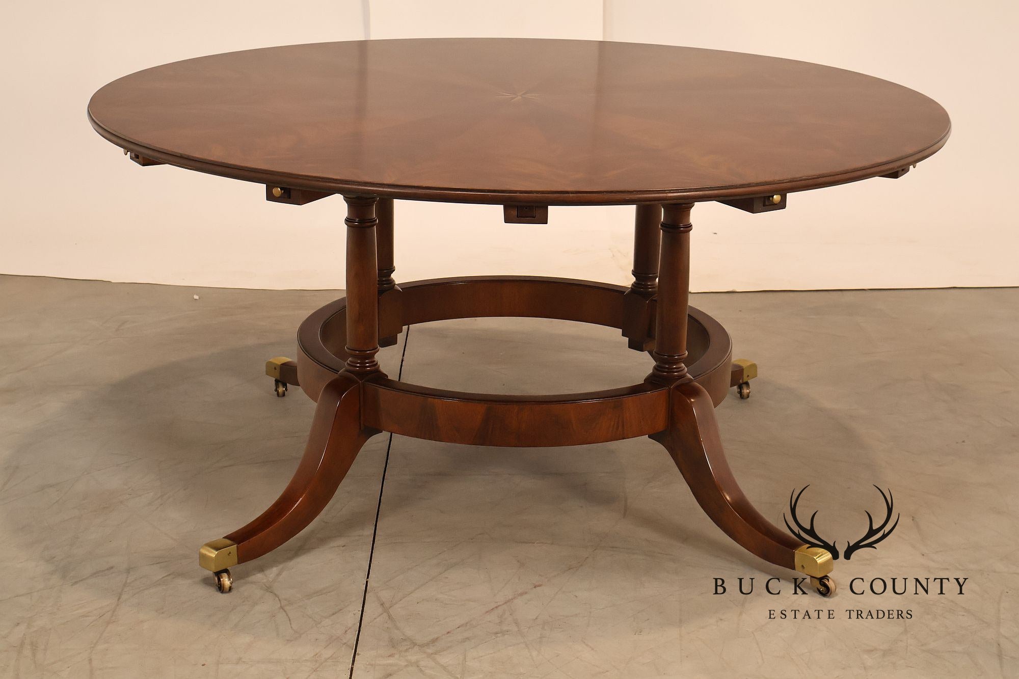 E.J. Victor Regency Style Round Inlaid Mahogany Pedestal Dining Table
