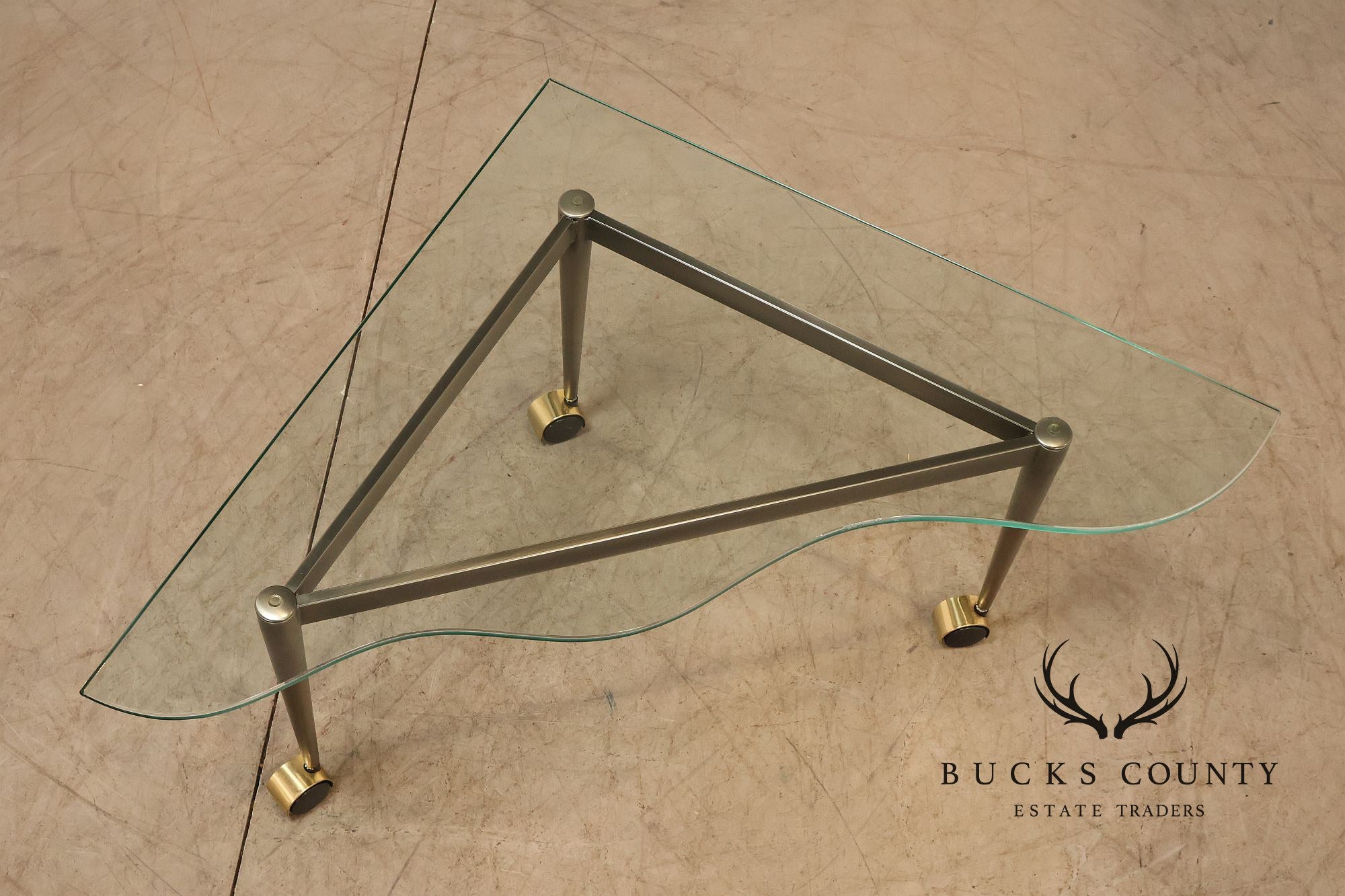 Postmodern Pair Of Triangular Glass Top Coffee Table with Brushed Steel Frame and Brass Casters