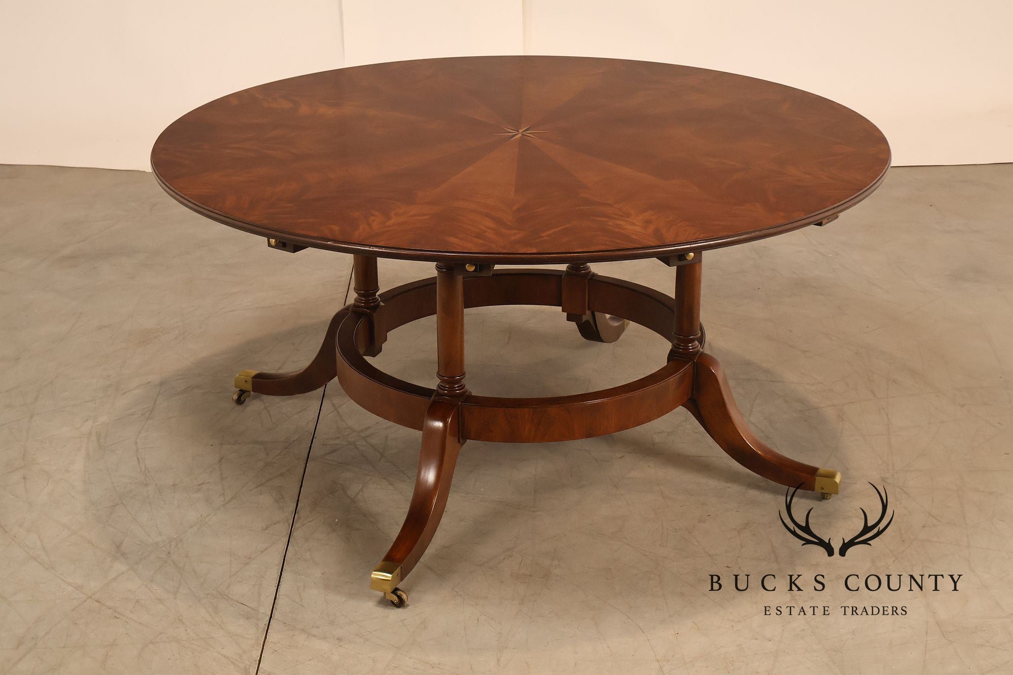 E.J. Victor Regency Style Round Inlaid Mahogany Pedestal Dining Table