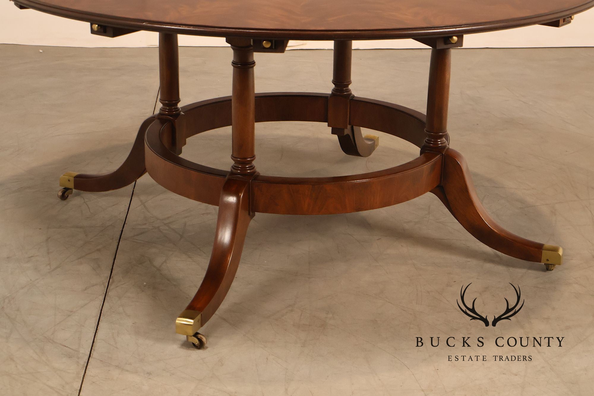 E.J. Victor Regency Style Round Inlaid Mahogany Pedestal Dining Table