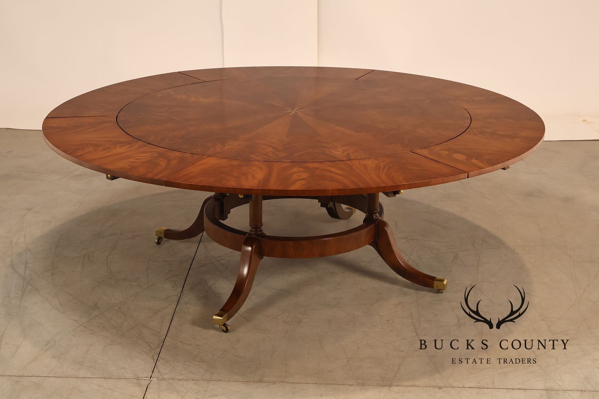 E.J. Victor Regency Style Round Inlaid Mahogany Pedestal Dining Table
