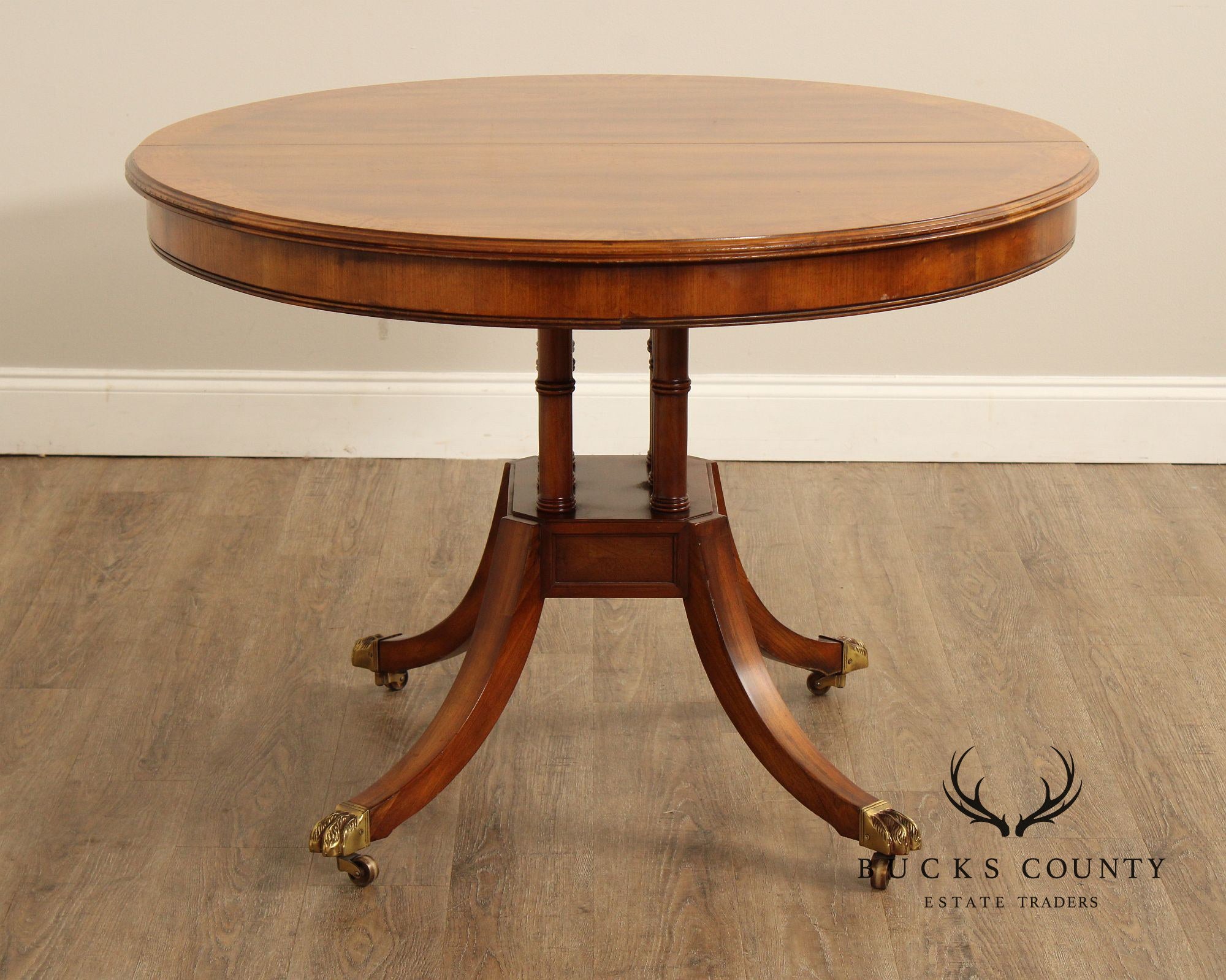 Union-National Inc. Regency Style Round Banded Mahogany Extendable Dining Table