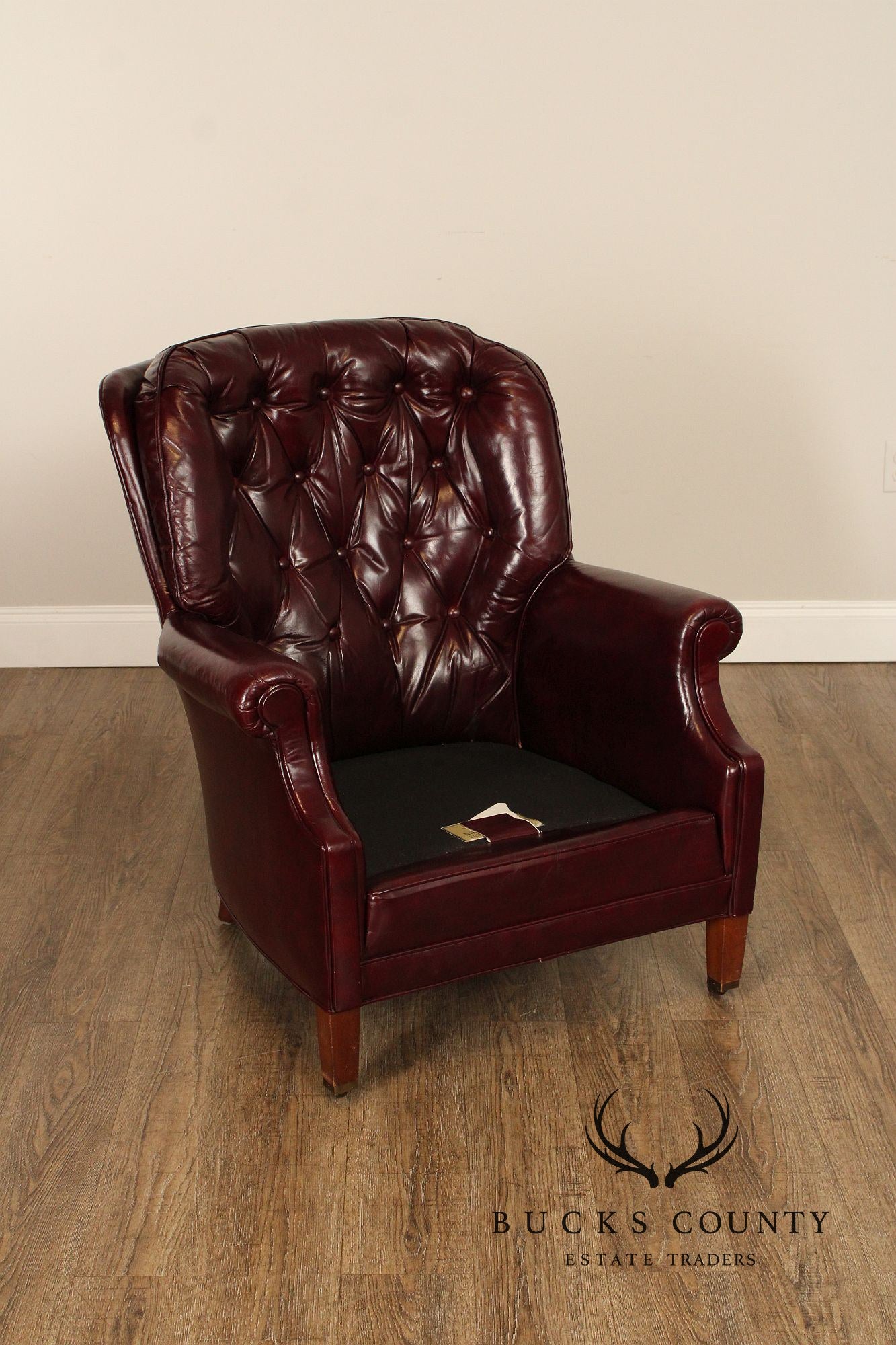 NORTH HICKORY OXBLOOD TUFTED LEATHER CHAIR AND OTTOMAN