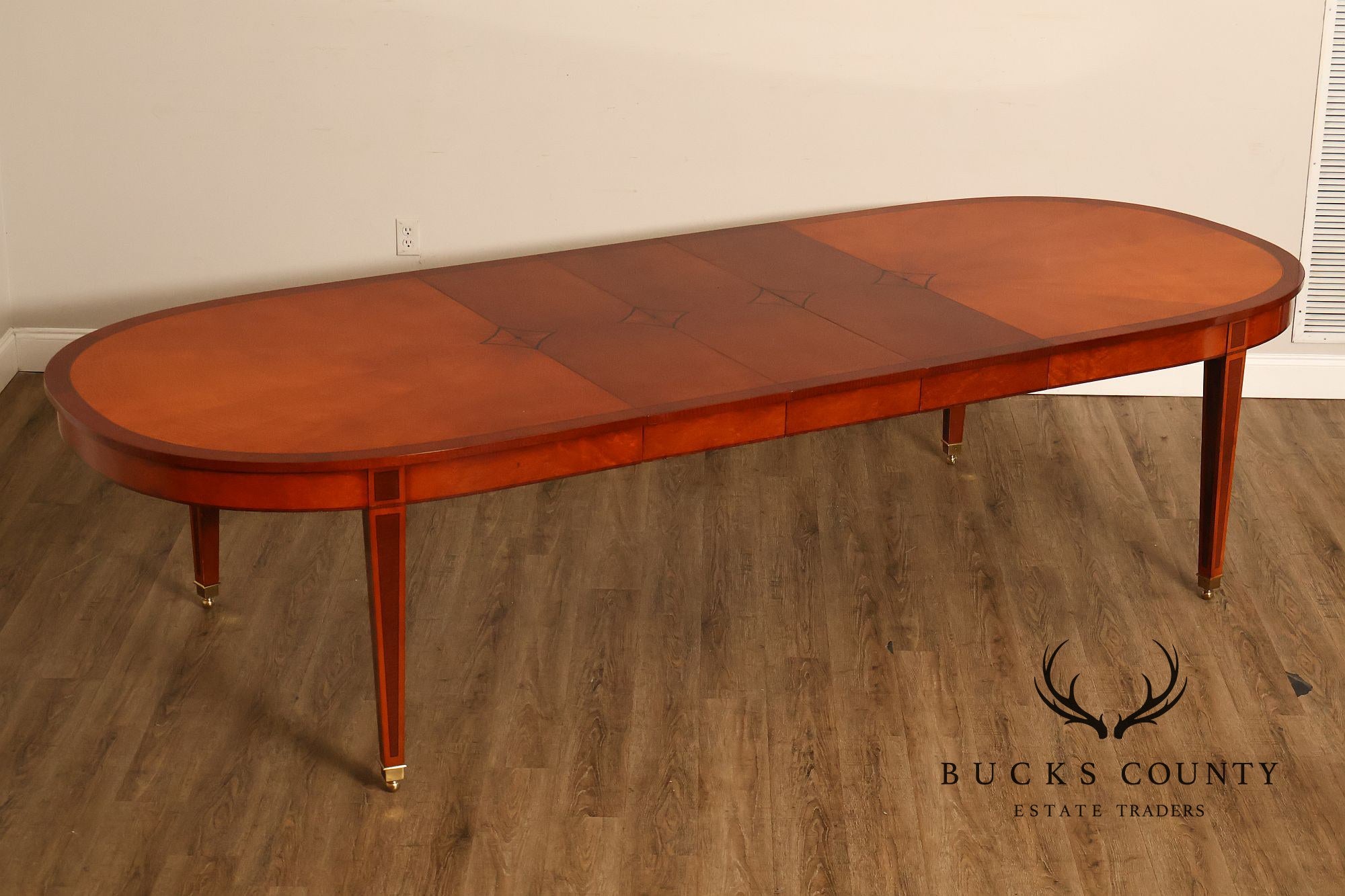 Kindel Kent Mahogany Banded Oval Dining Table with Three Leaves