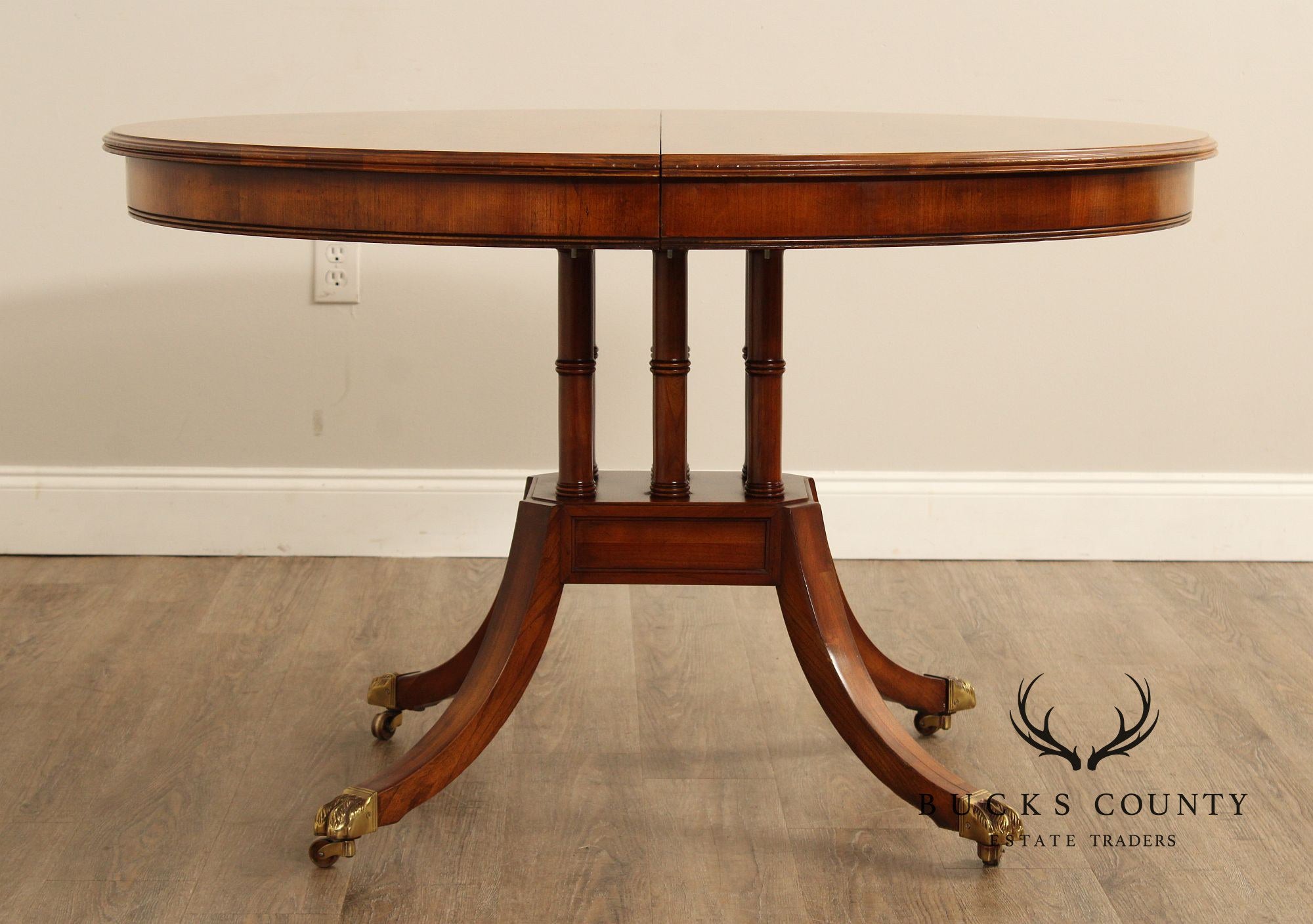 Union-National Inc. Regency Style Round Banded Mahogany Extendable Dining Table