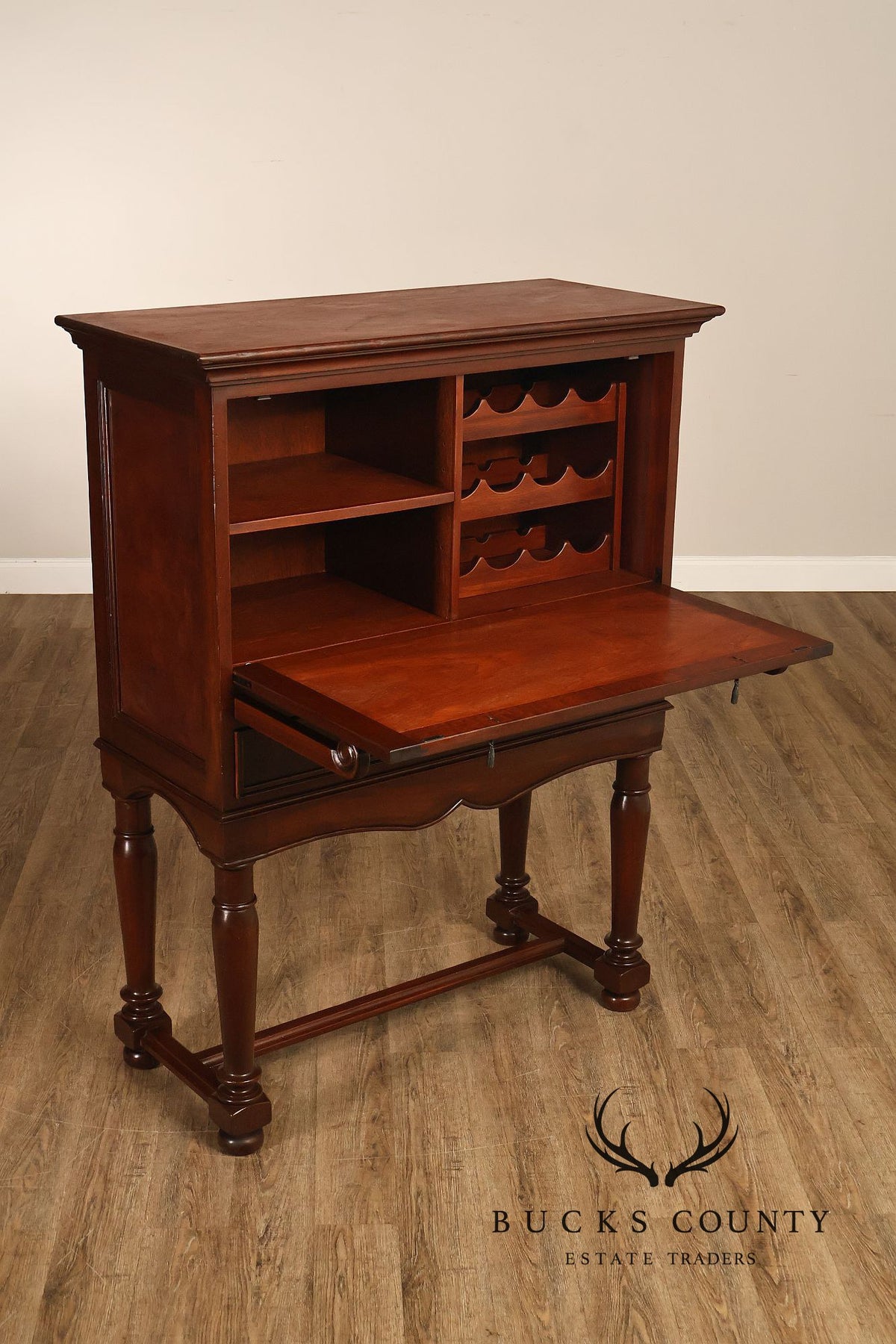 Traditional English Style Drop Front Bar Cabinet With A Stretcher Base