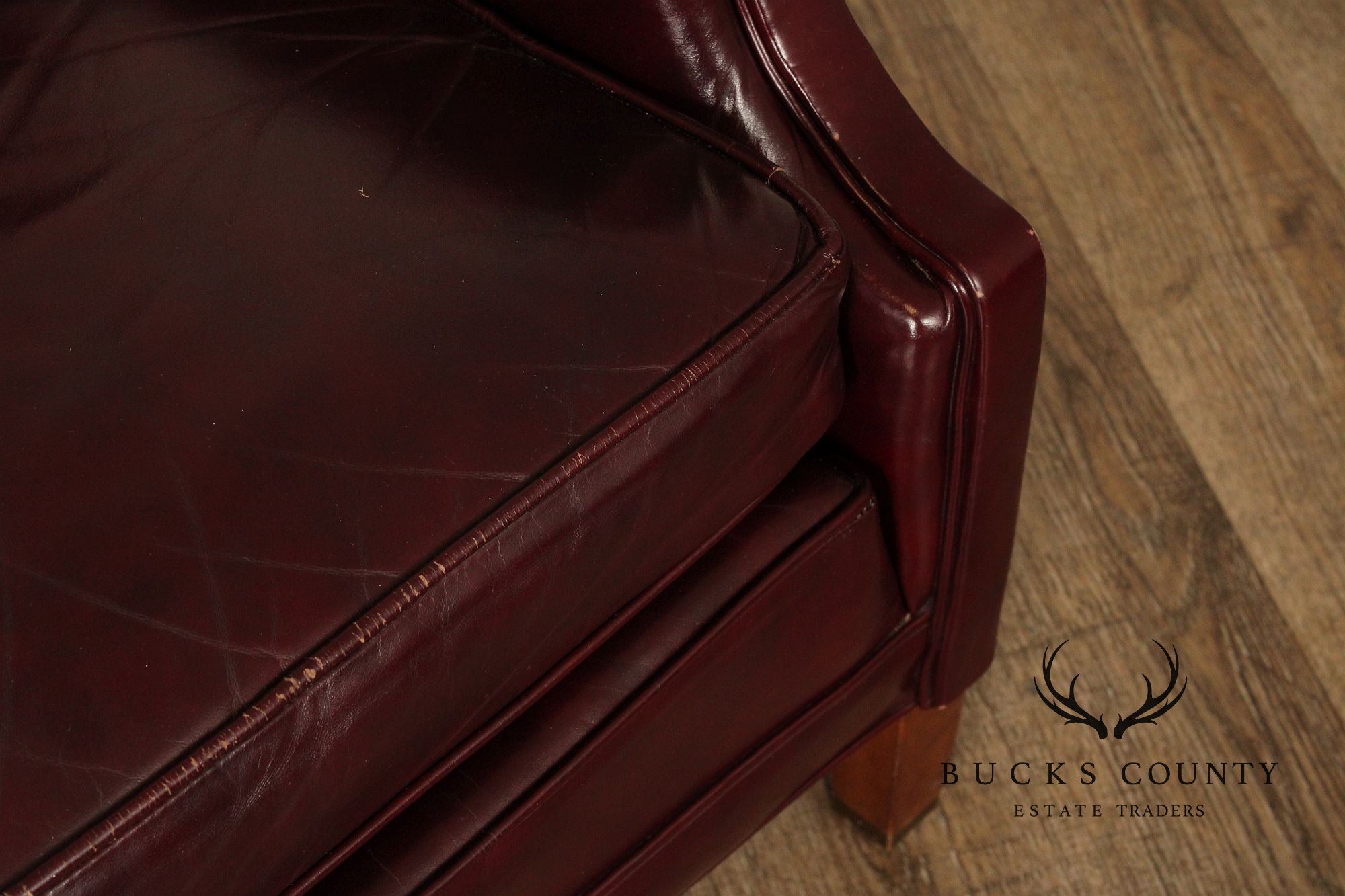 NORTH HICKORY OXBLOOD TUFTED LEATHER CHAIR AND OTTOMAN