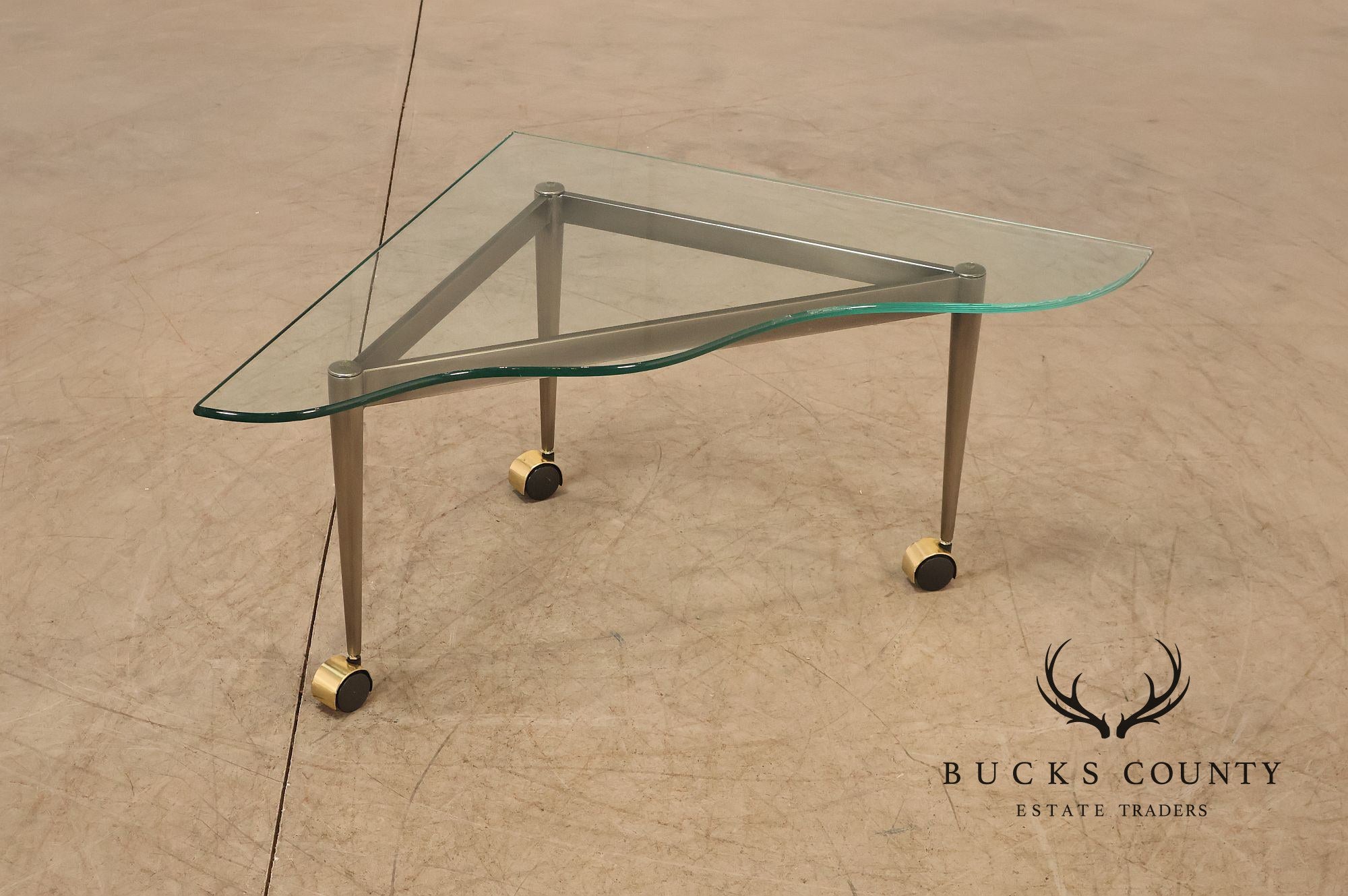 Postmodern Pair Of Triangular Glass Top Coffee Table with Brushed Steel Frame and Brass Casters
