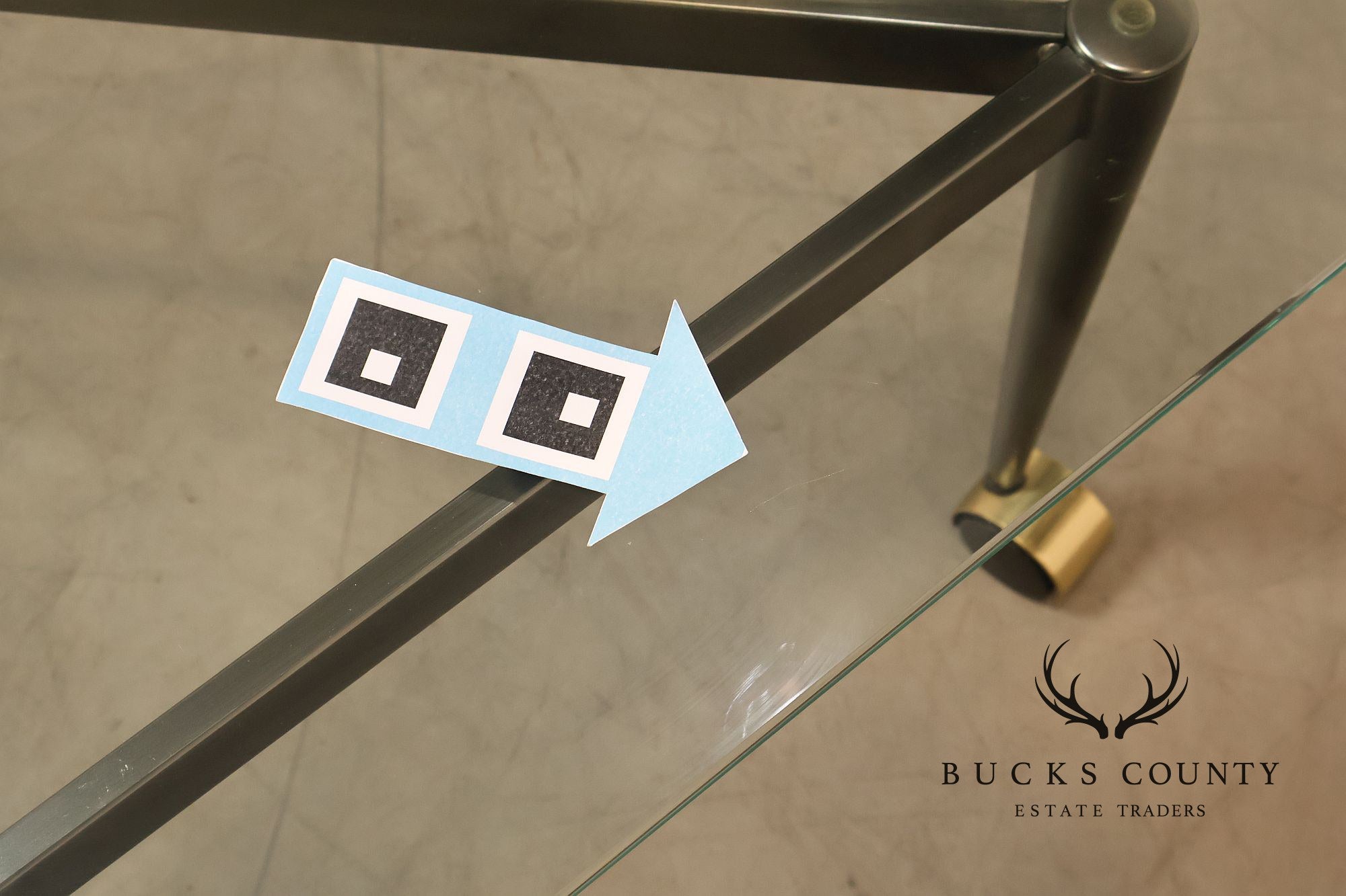 Postmodern Pair Of Triangular Glass Top Coffee Table with Brushed Steel Frame and Brass Casters