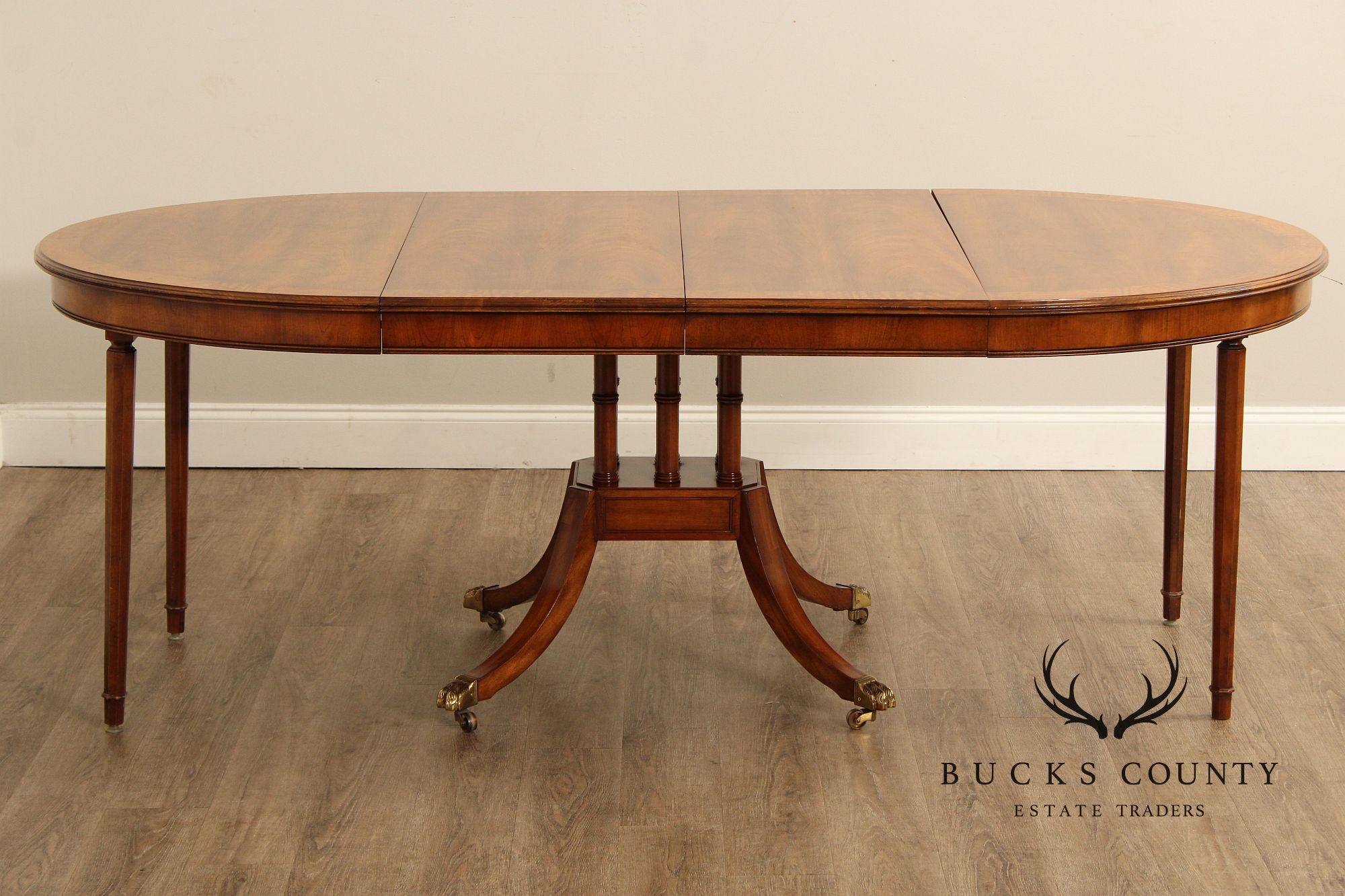 Union-National Inc. Regency Style Round Banded Mahogany Extendable Dining Table