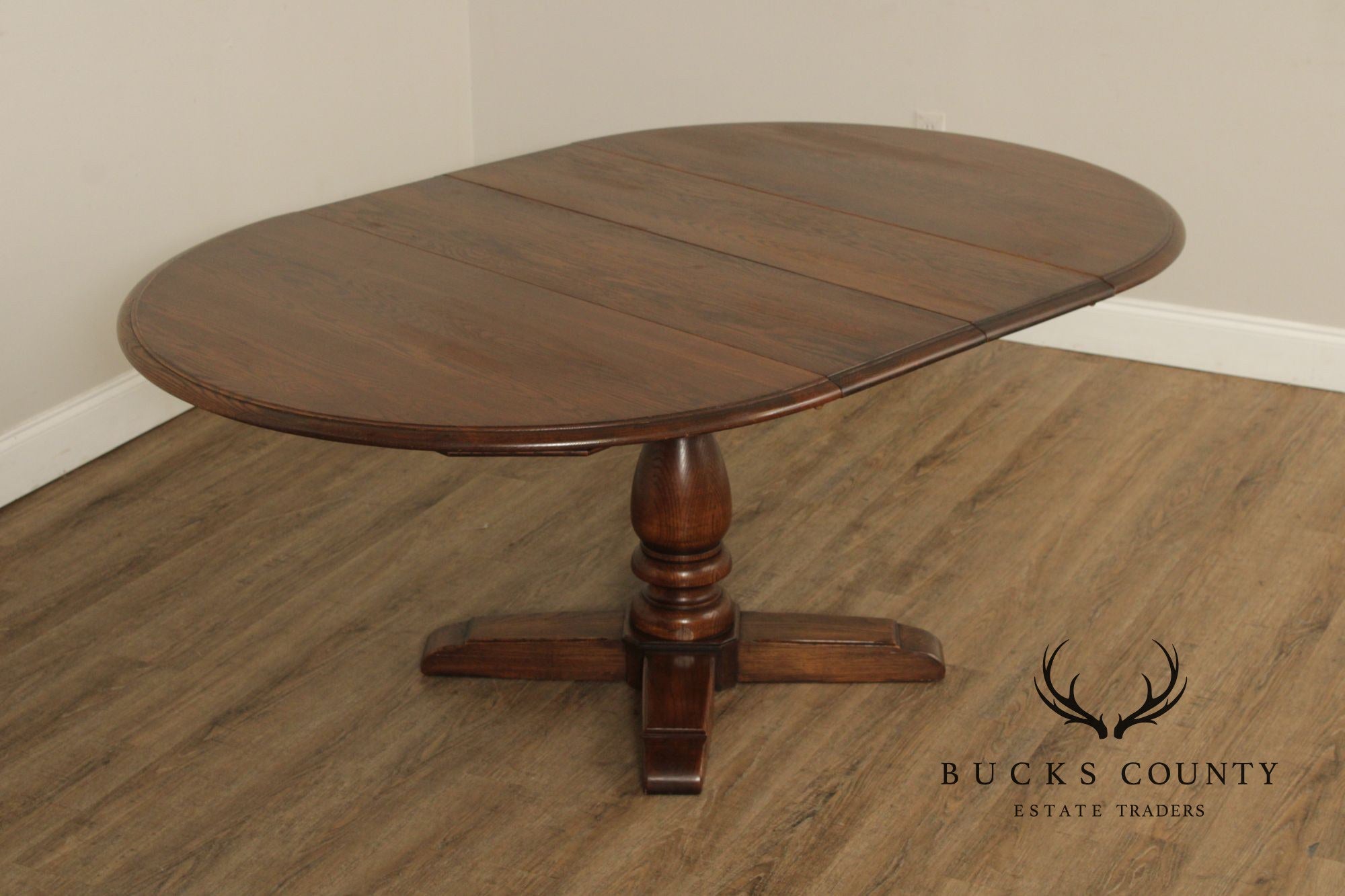 Conant Ball Round Oak Single Pedestal Dining Table With Two Leaves