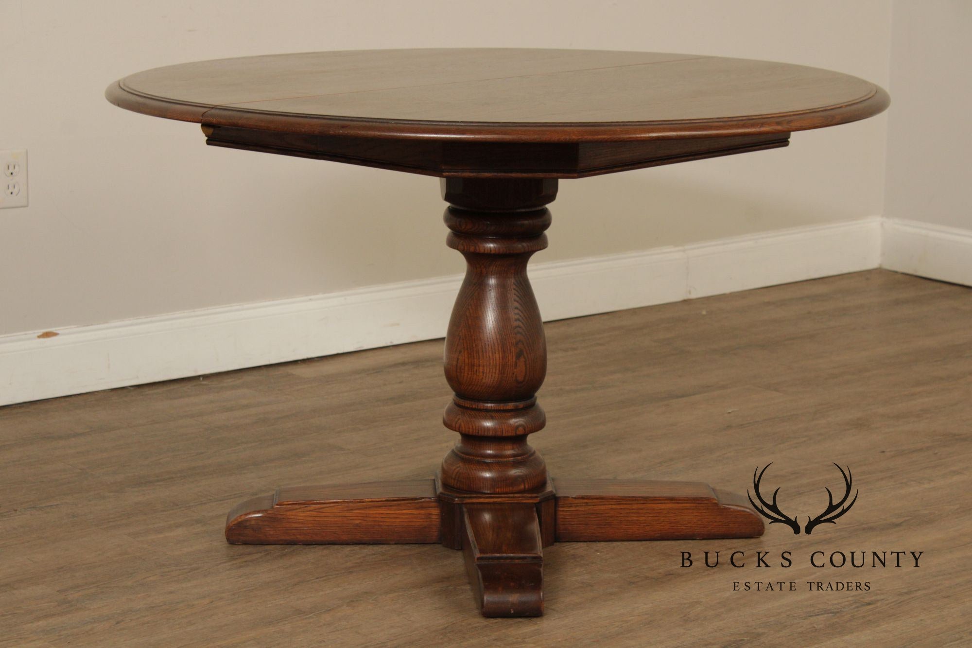 Conant Ball Round Oak Single Pedestal Dining Table With Two Leaves