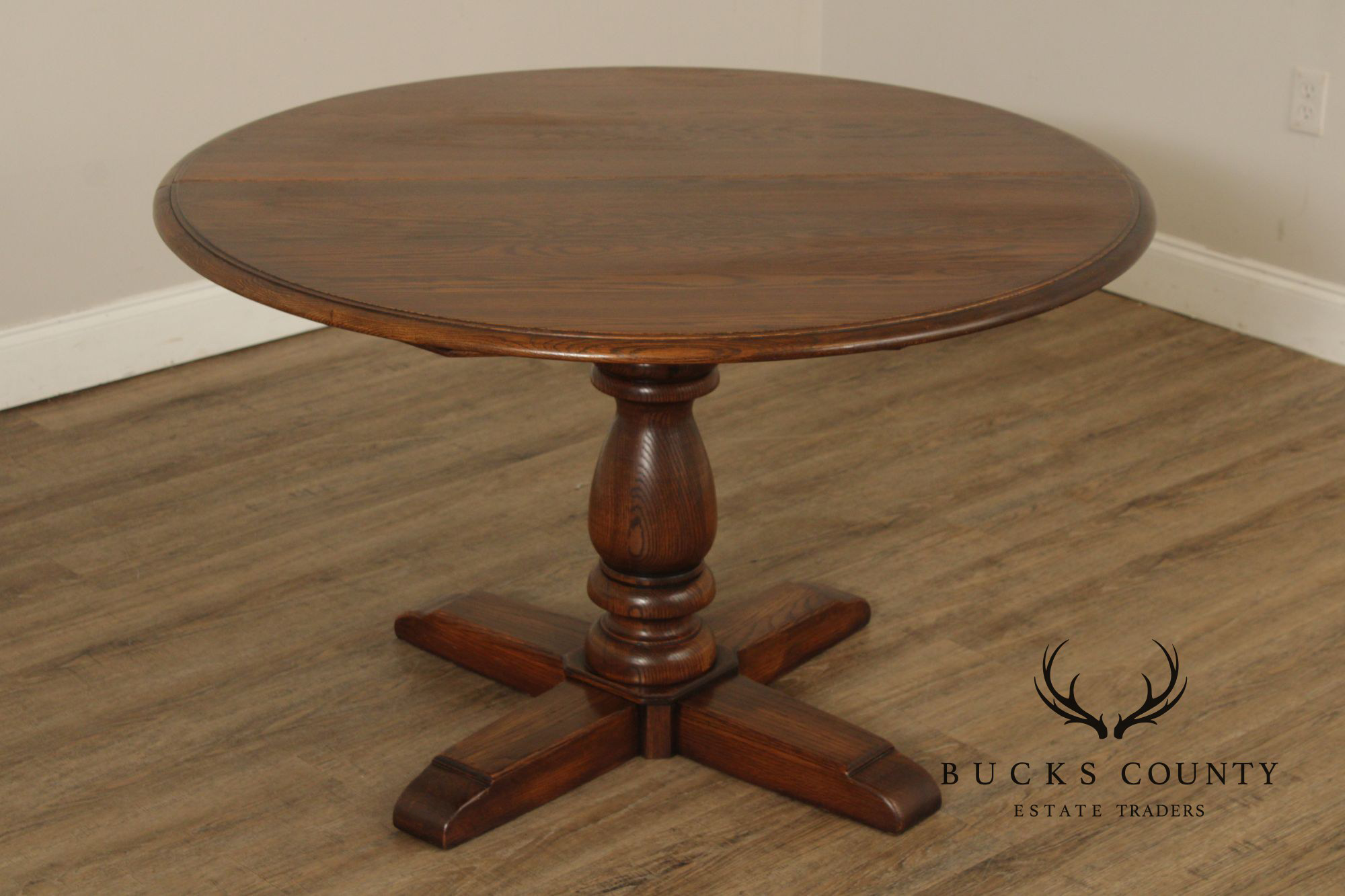 Conant Ball Round Oak Single Pedestal Dining Table With Two Leaves
