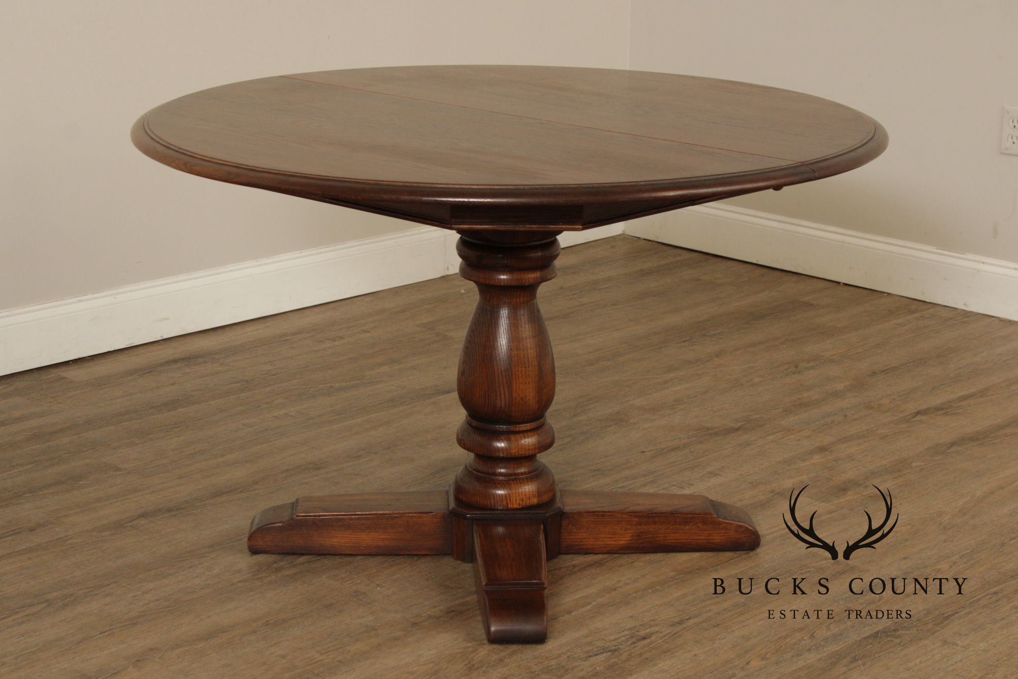 Conant Ball Round Oak Single Pedestal Dining Table With Two Leaves