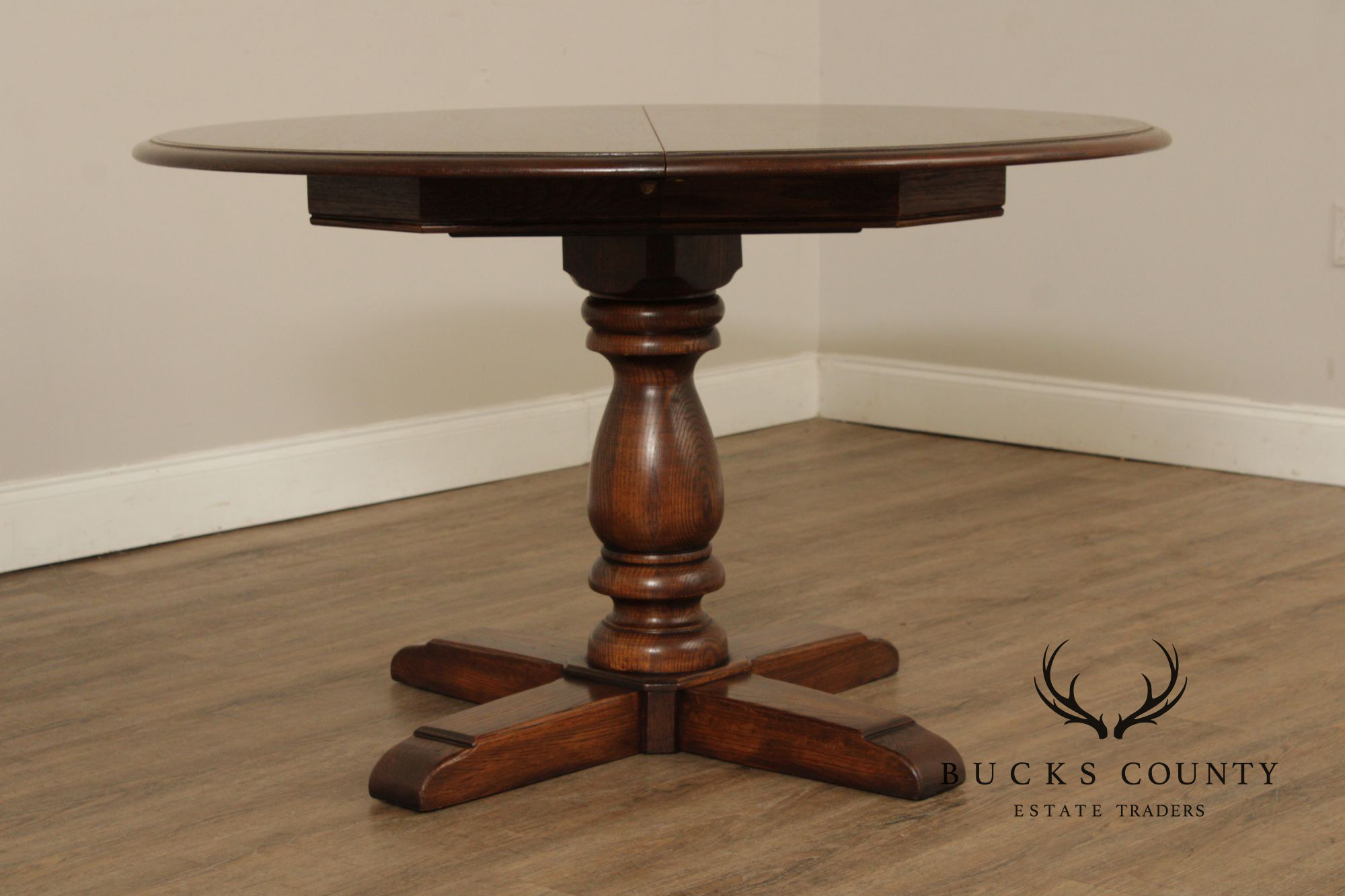 Conant Ball Round Oak Single Pedestal Dining Table With Two Leaves