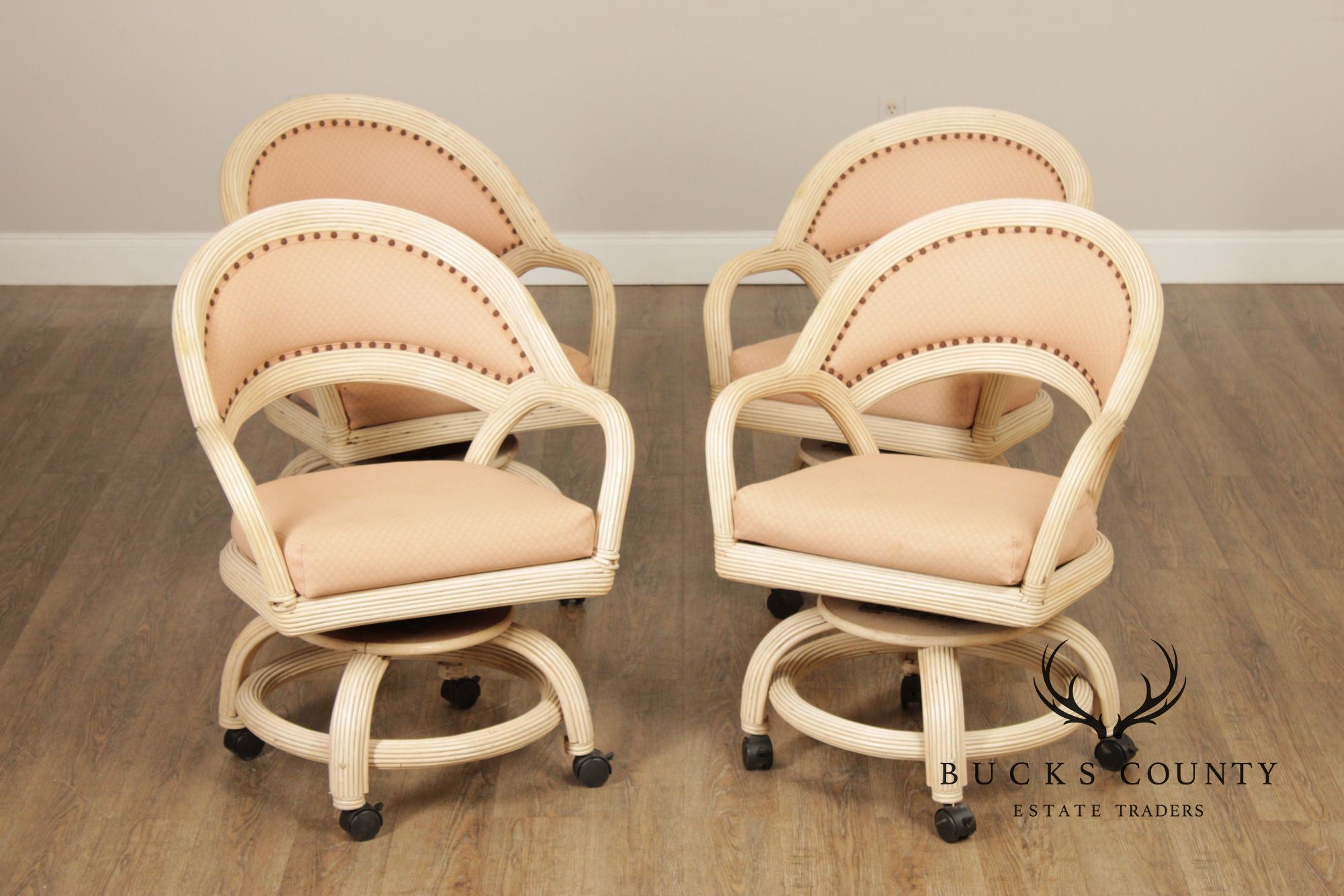Set Of Four Mid-Century Rattan Swivel Rolling Dining Chairs With Upholstered Seats