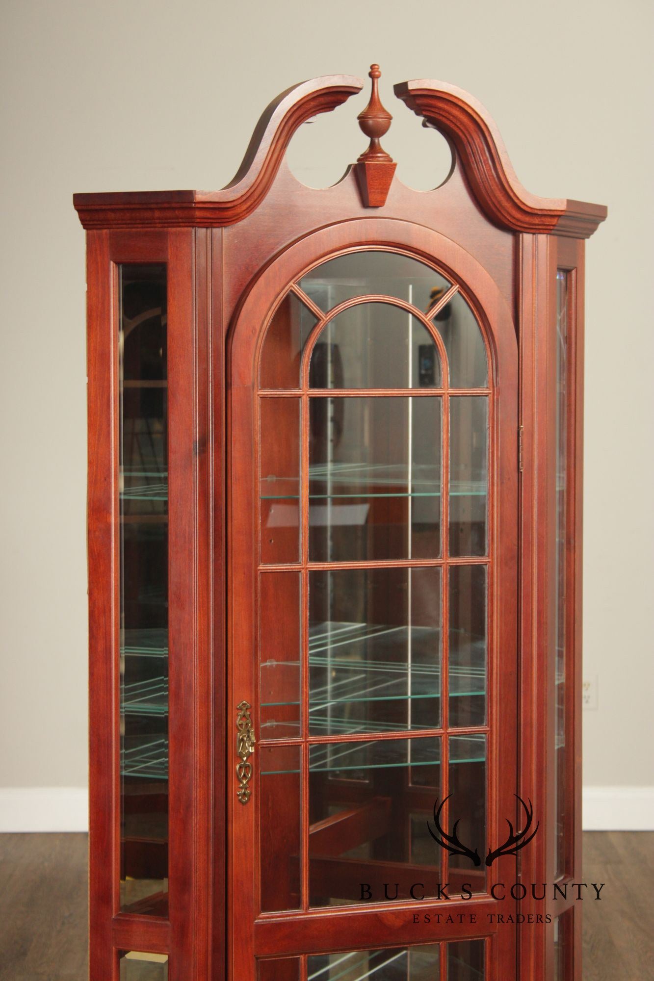 Pulaski Traditional Lighted Cherry Corner Curio Cabinet With Arched Pediment