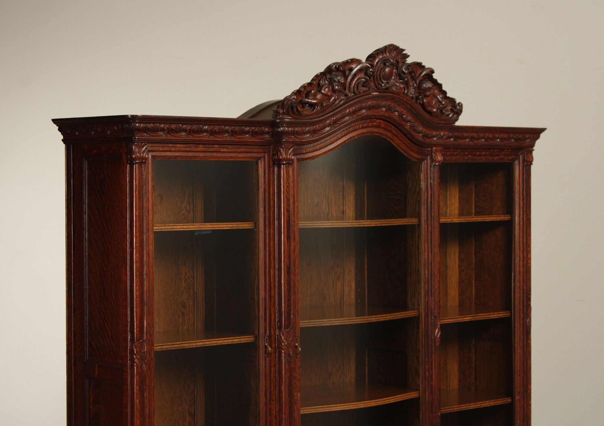 Antique Victorian Rococo Revival Oak Carved Glass Triple Door Bookcase