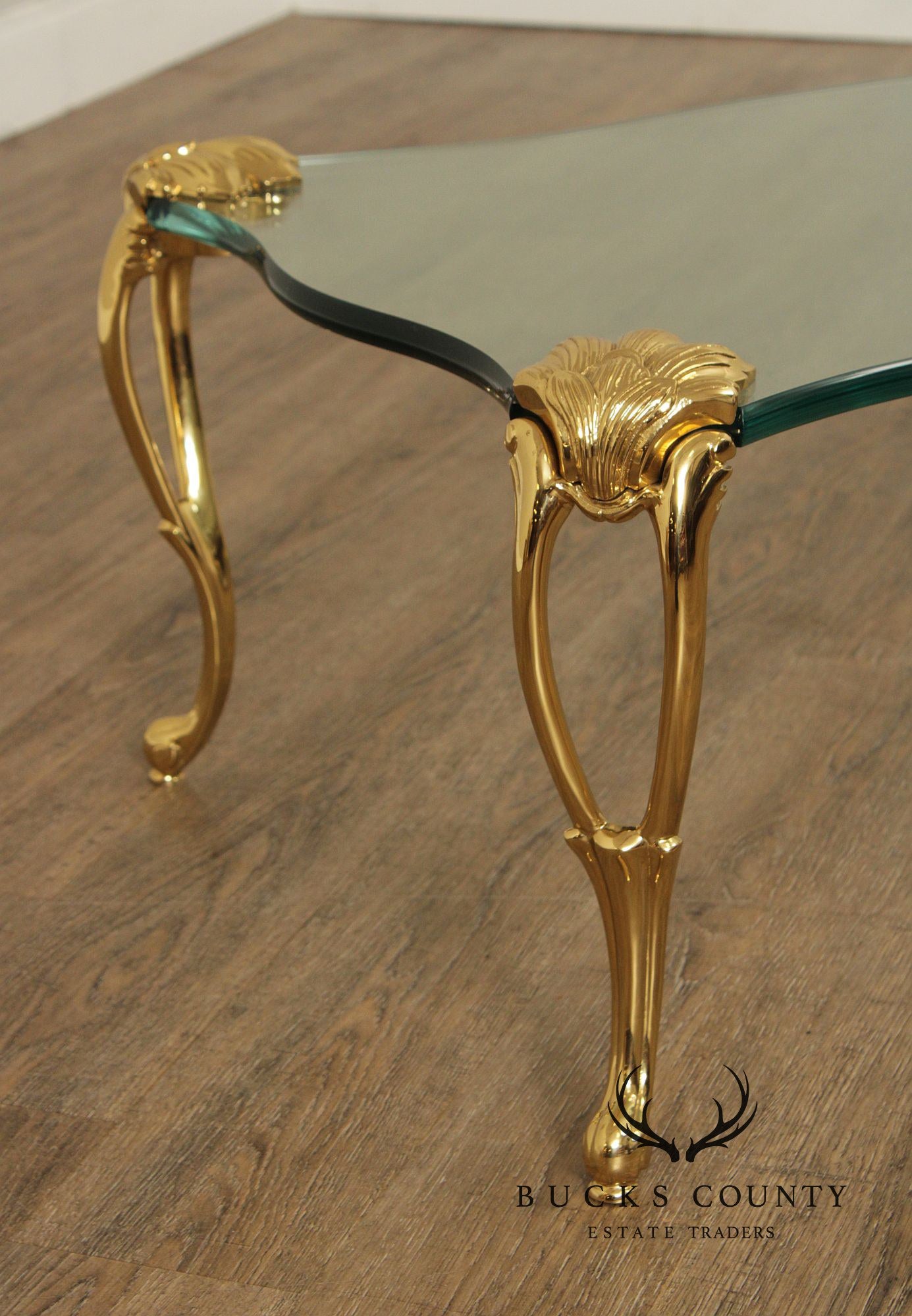 French Style Glass Top Coffee Table With Sculpted Brass Legs