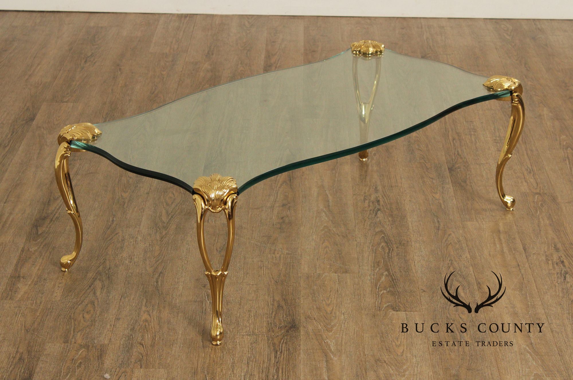 French Style Glass Top Coffee Table With Sculpted Brass Legs