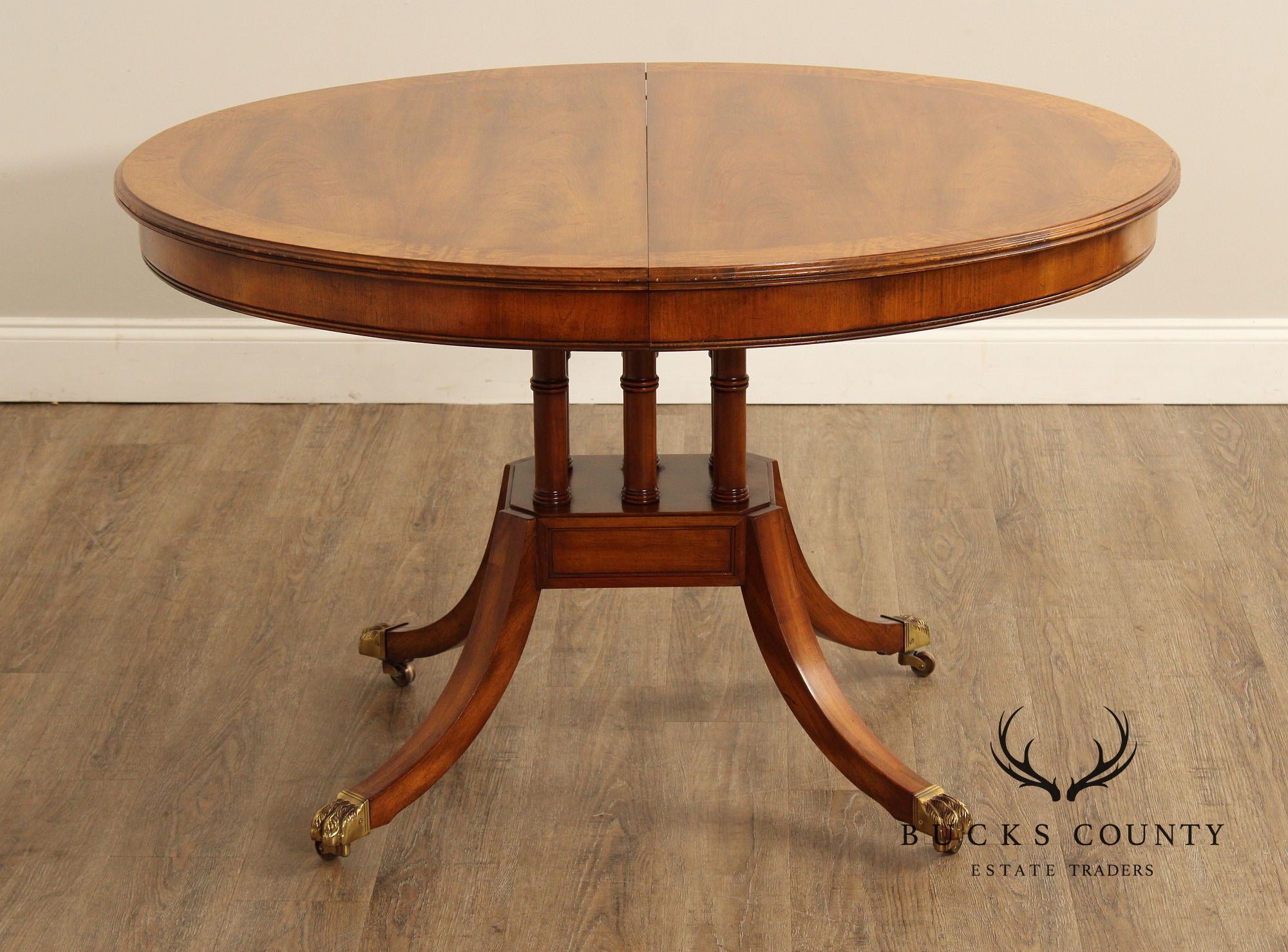 Union-National Inc. Regency Style Round Banded Mahogany Extendable Dining Table