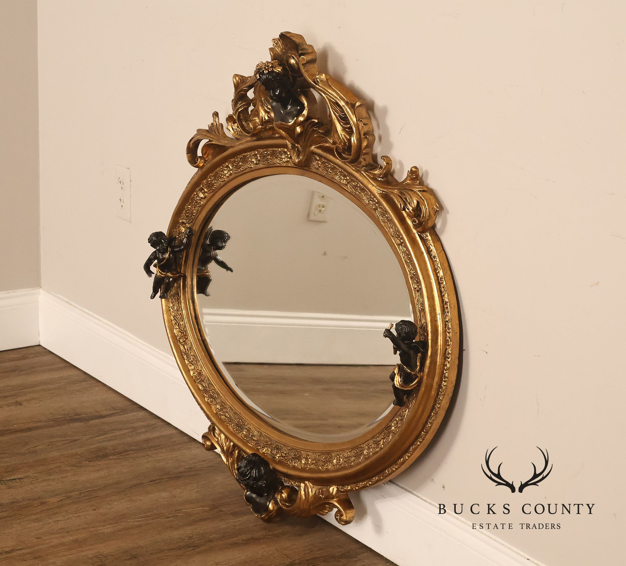 Italian Renaissance Style Cherub Mounted Oval Mirror