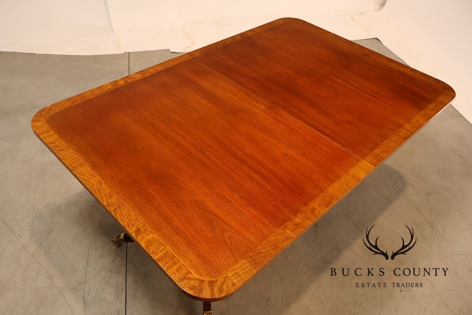 Baker Furniture Company Regency Style Mahogany Double Pedestal Dining Table With Satinwood Banding And Extension Leaves