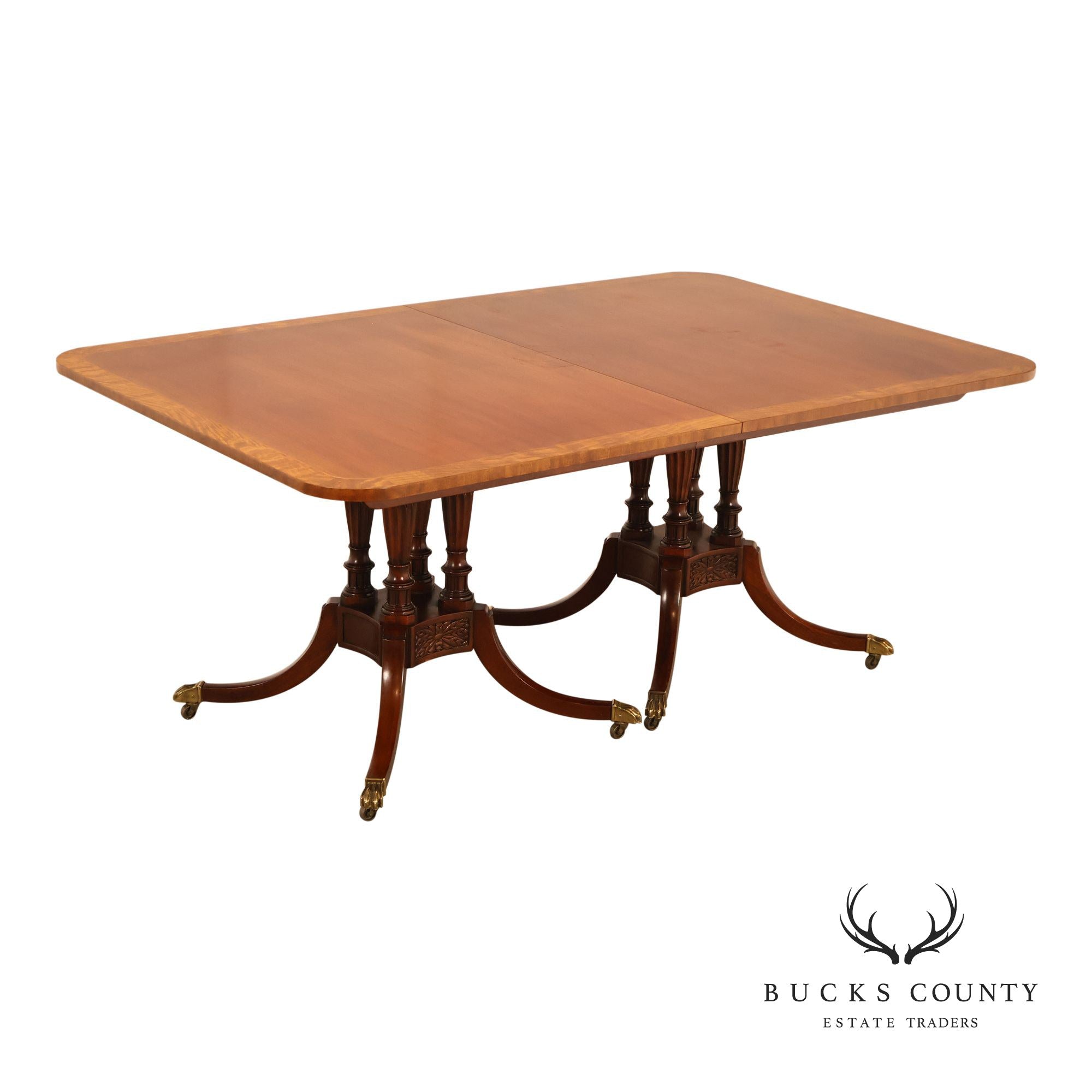 Baker Furniture Company Regency Style Mahogany Double Pedestal Dining Table With Satinwood Banding And Extension Leaves