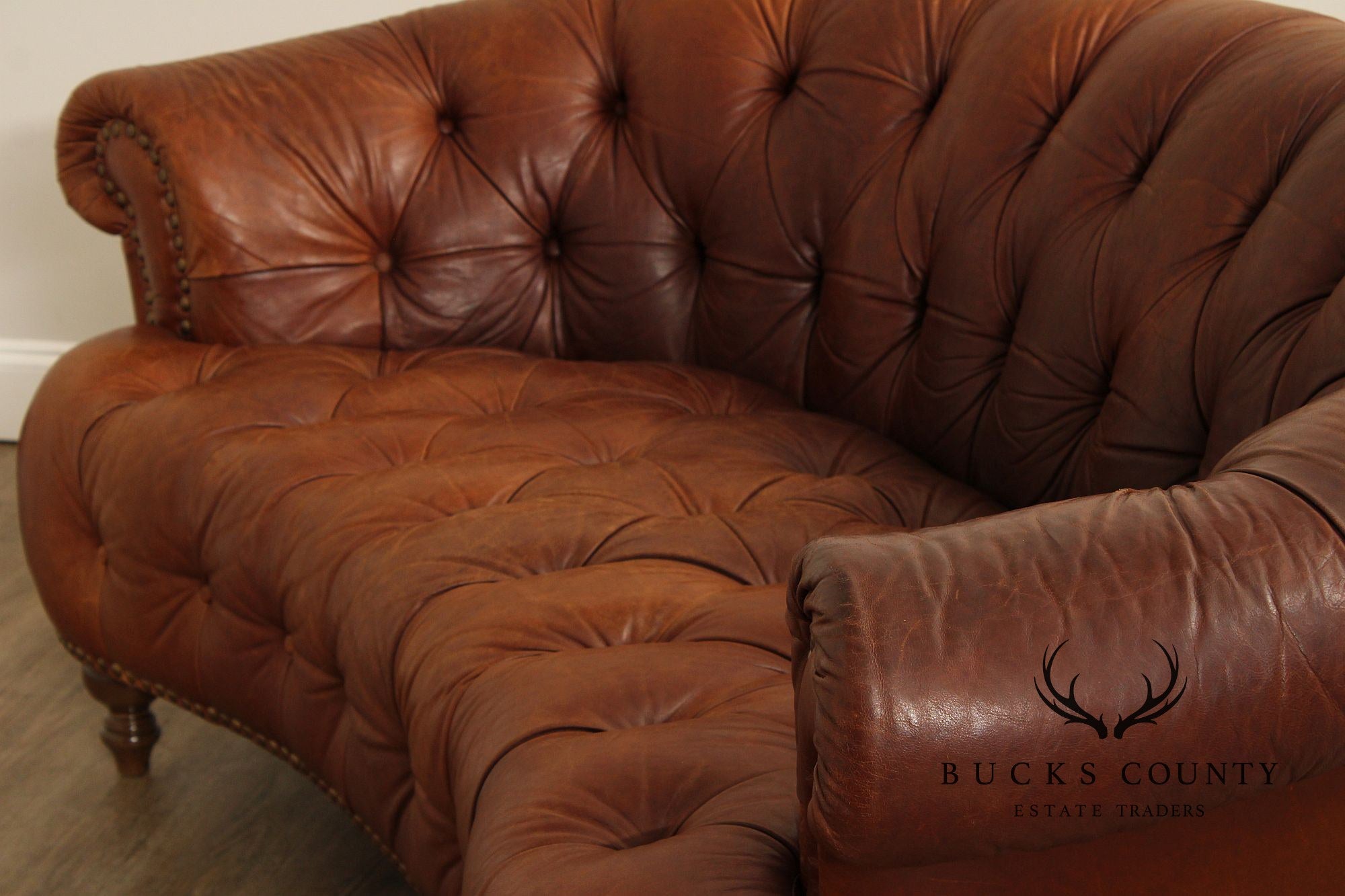 English Traditional Tufted Leather Curved Chesterfield Sofa